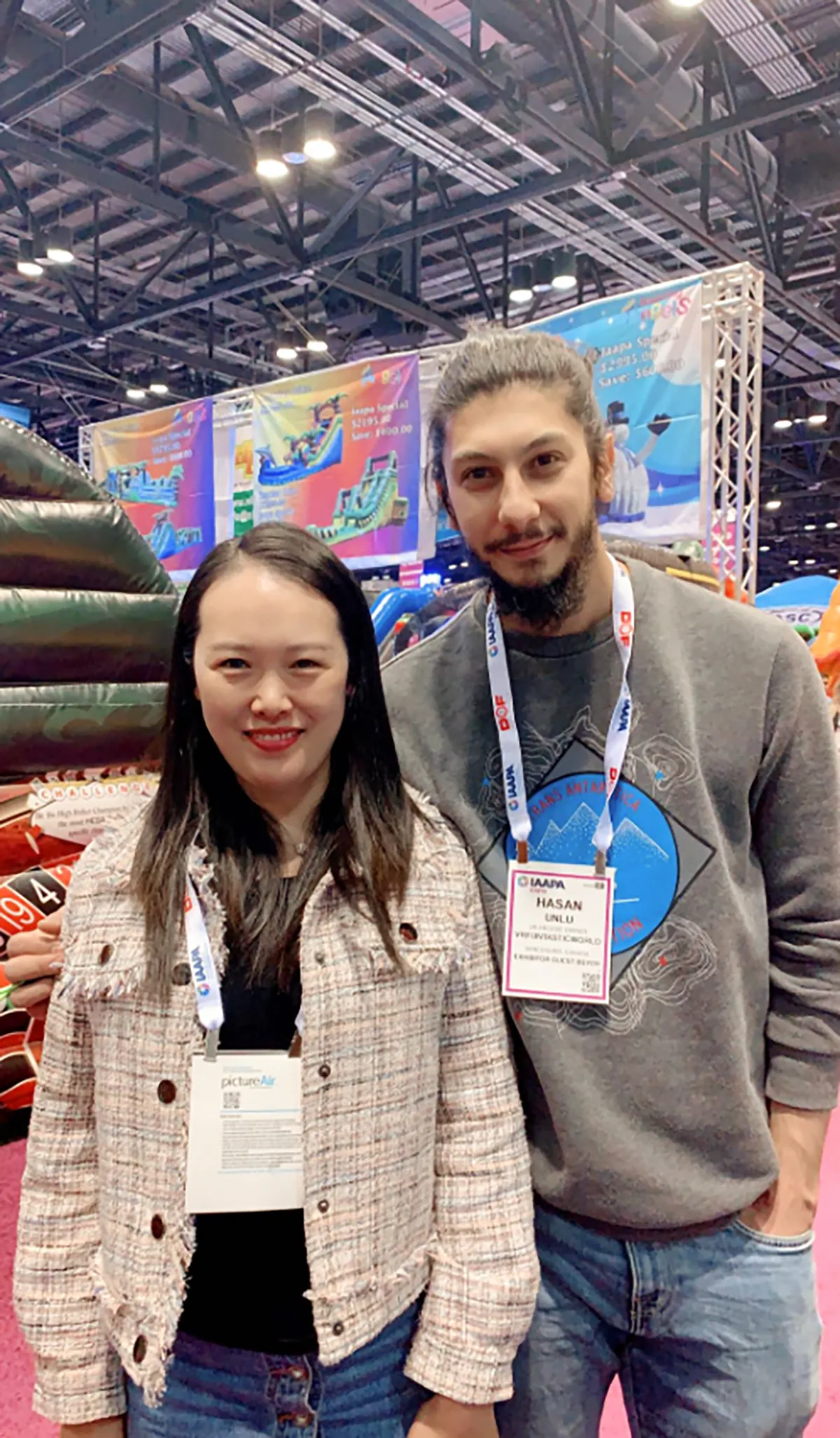 Shanghai Qiqu Fun Founder Emily consulting with a returning North American operator expanding their commercial amusement ride fleet at IAAPA Expo Orlando 2019