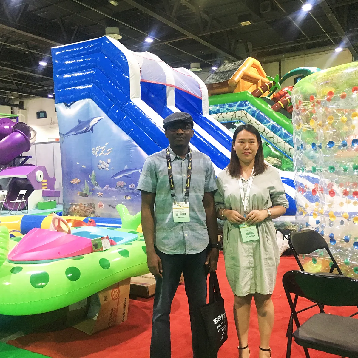 Shanghai Qiqu Fun Founder Emily meeting with a legacy global partner for exclusive custom commercial inflatables at IAAPA Dubai 2018
