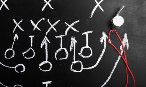 a football play drawn up on a chalkboard