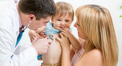 A doctor checking the baby. At Little Big Dreamers, Mylee a certified specialist assist and counsel the families