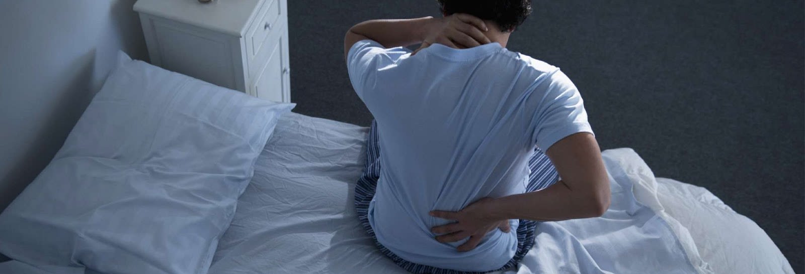 How to Sleep Better With Back Pain [7 Sleep Positions 2024]