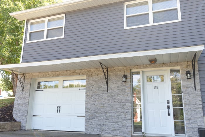 Garage and front-door elevation with stone cladding, Moncton