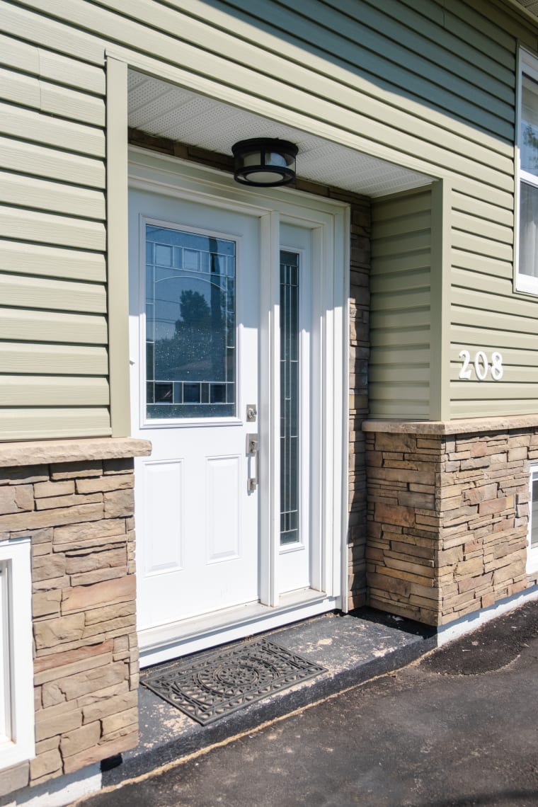 Finished home with new windows and doors by Maritime Stone & Decor