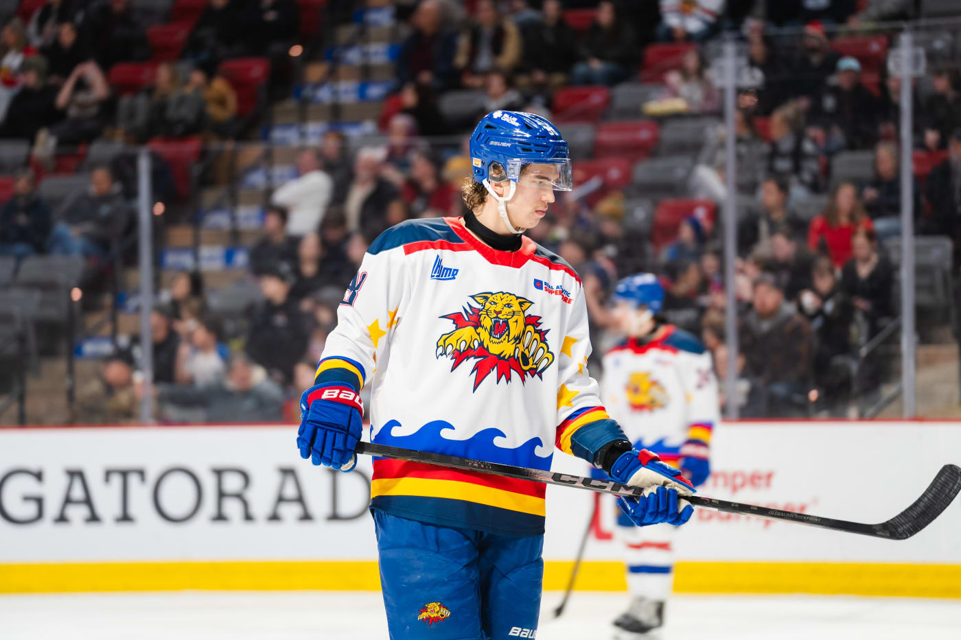 Moncton Wildcats wearing Jack Livingstone's Acadian-inspired jersey