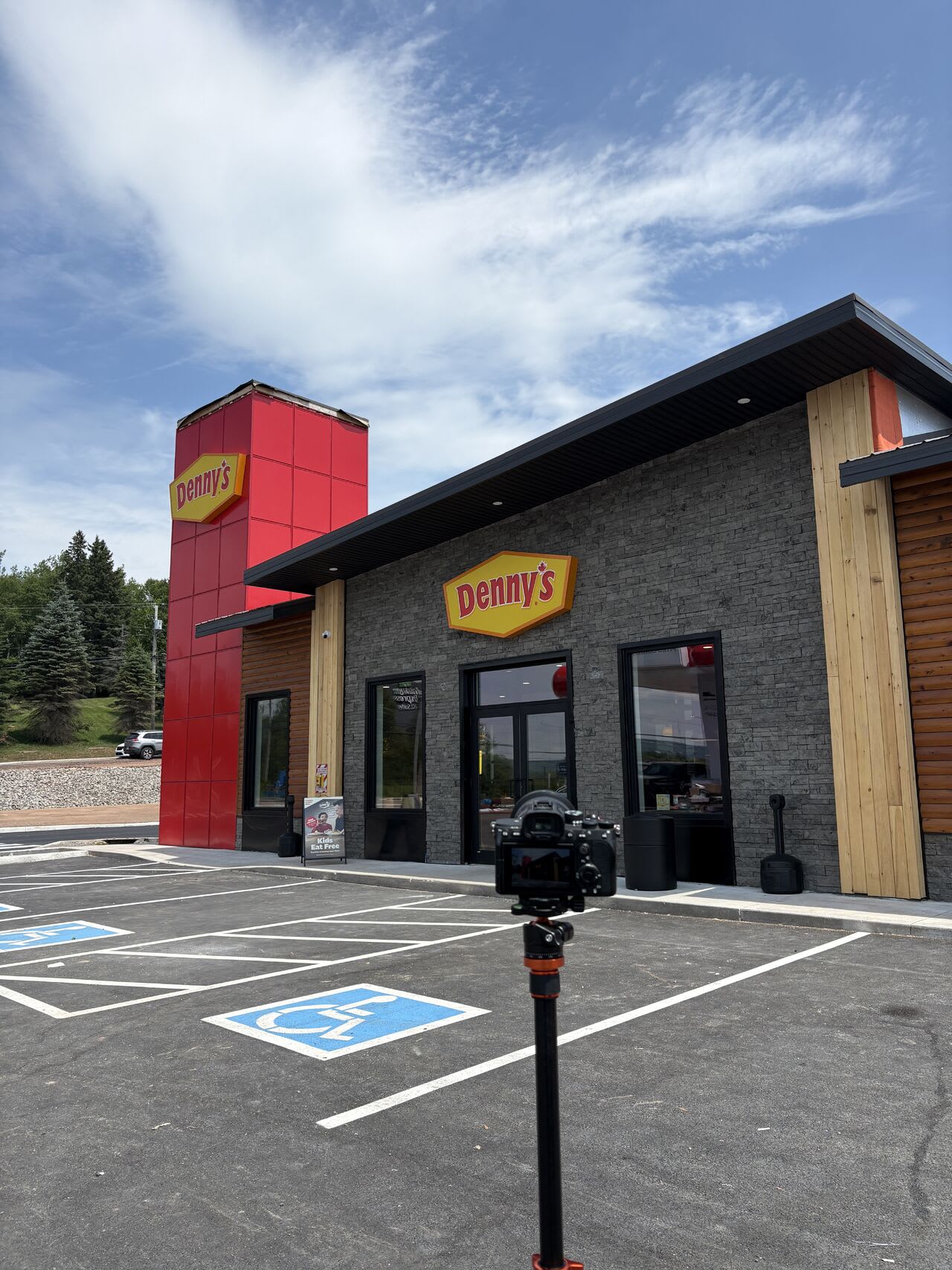 LIF Media camera on a tripod in the empty parking lot of the new Denny's at 70 Queensway Drive, Moncton NB, a few days before opening
