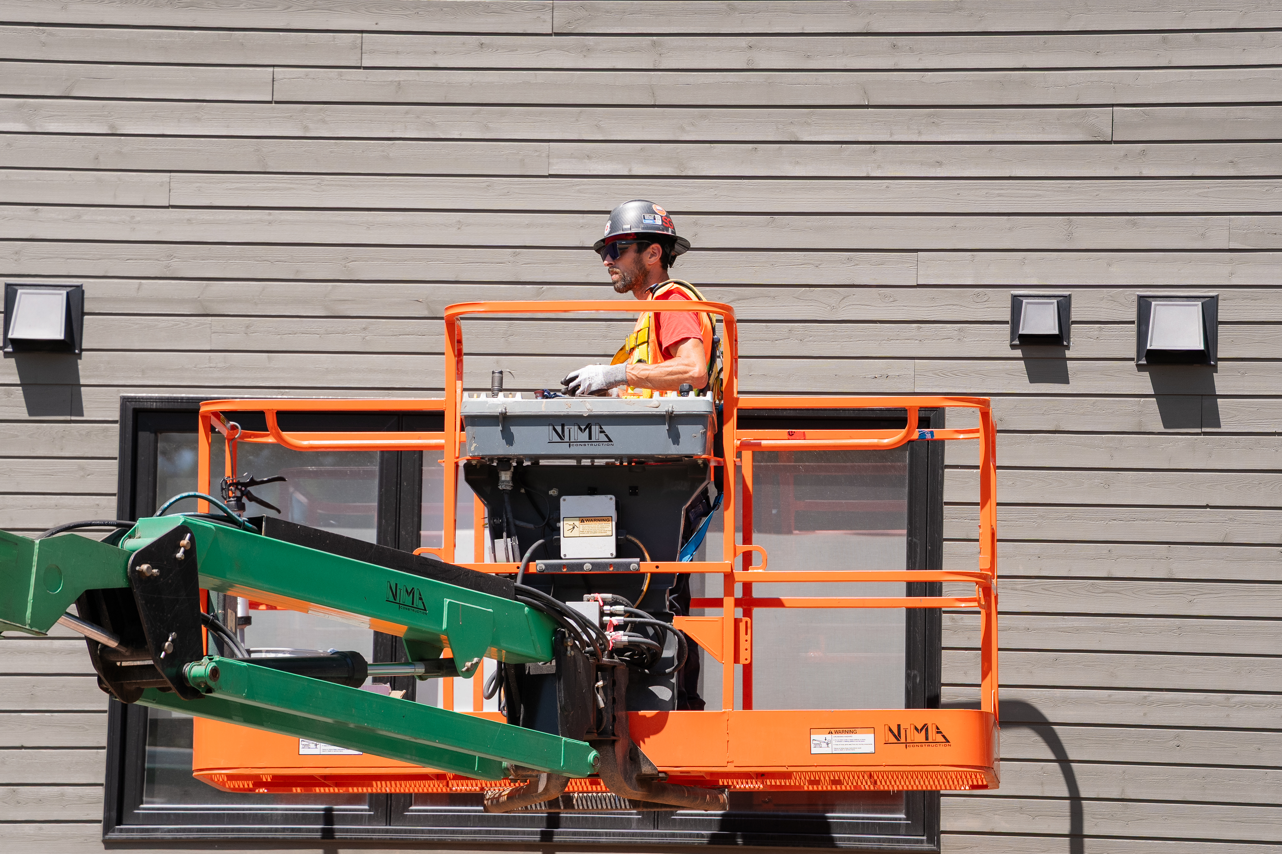 Construction hero video for Premium MG — fireproofing, firestopping, caulking, drywall — produced by LIF Media in Atlantic Canada