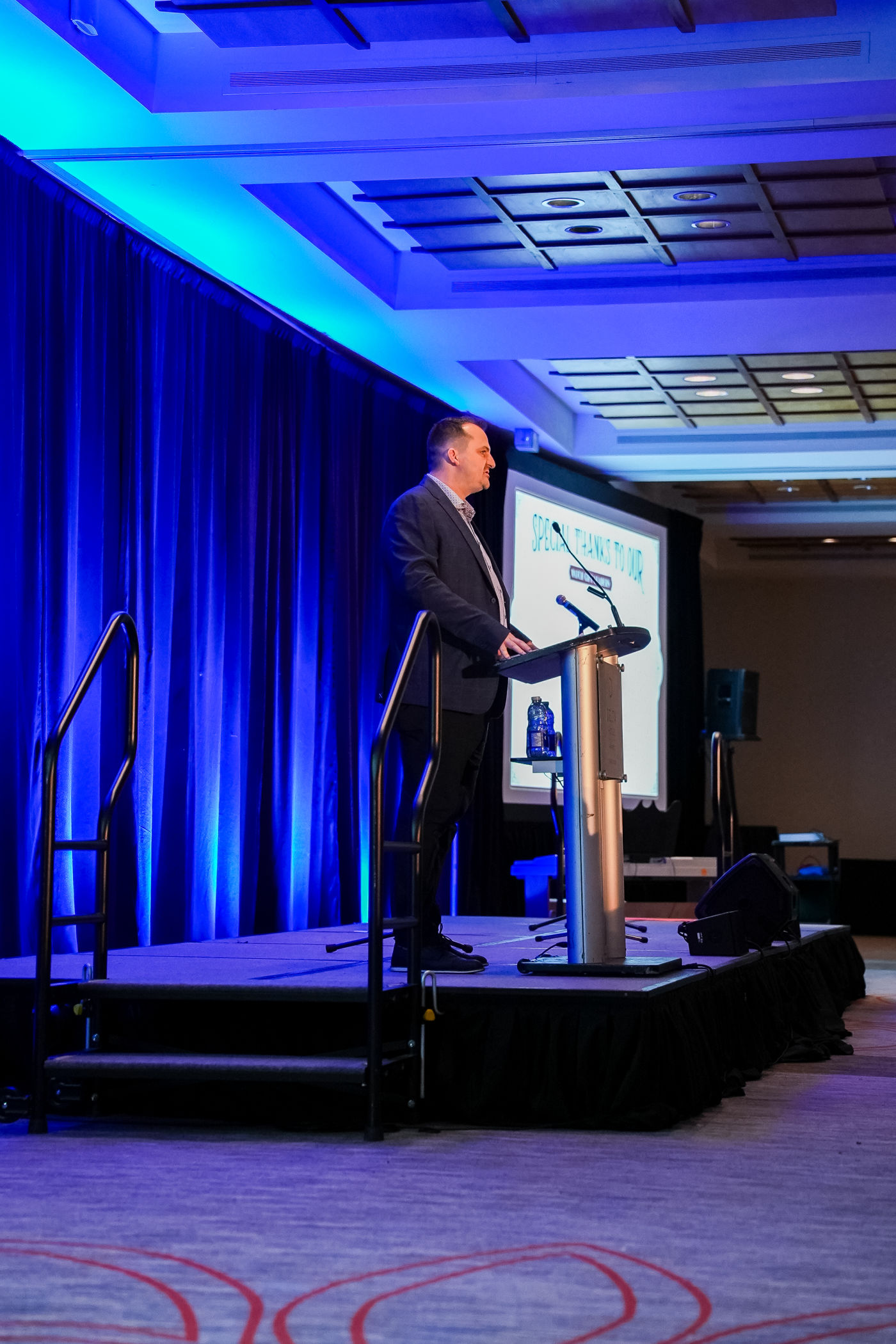 J.A. Kelly founder Jordan Kelly speaking on stage at the Atlantic Men's Centre Gala