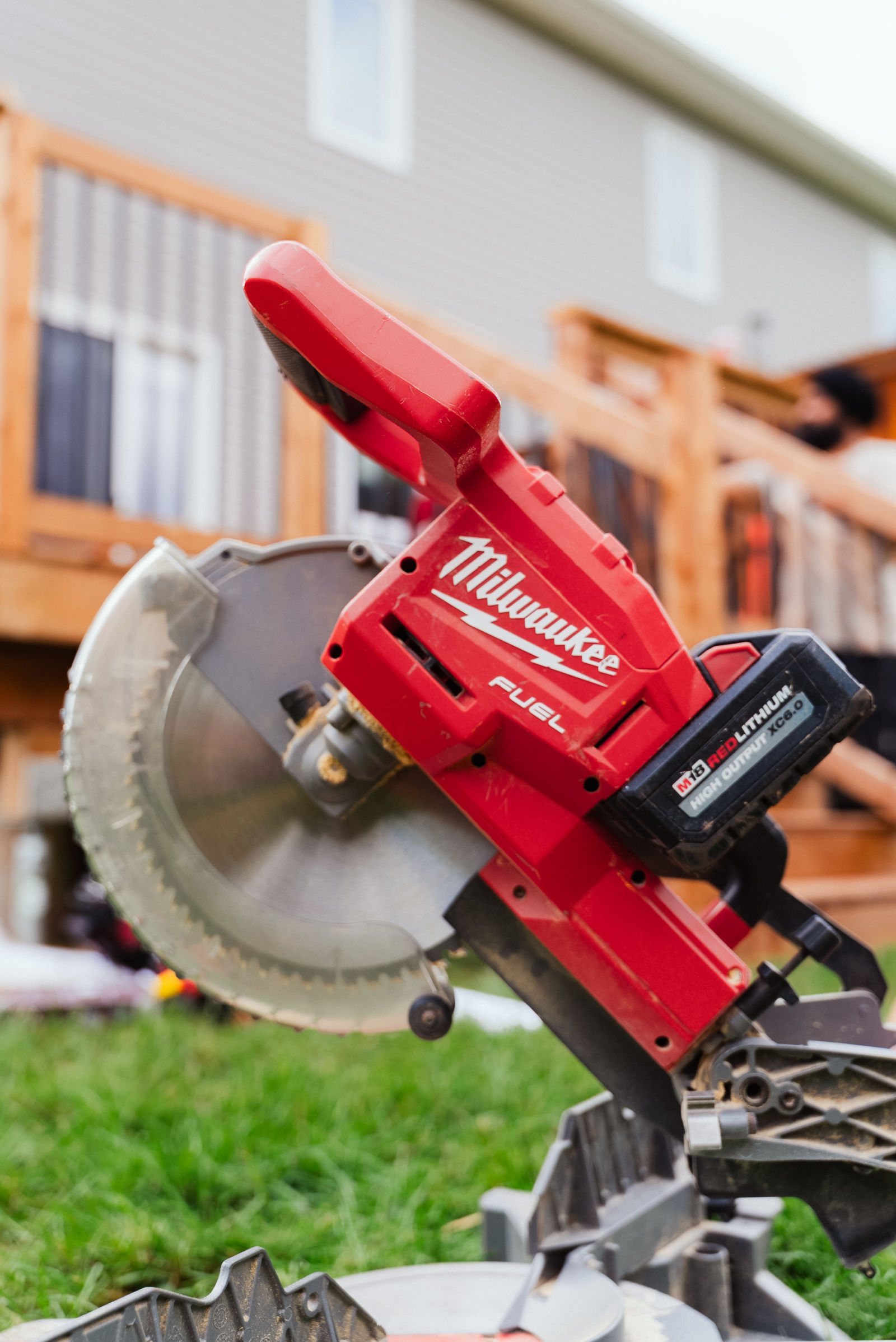 Milwaukee M18 FUEL cordless mitre saw on site at a J.A. Kelly deck build in Dieppe, NB