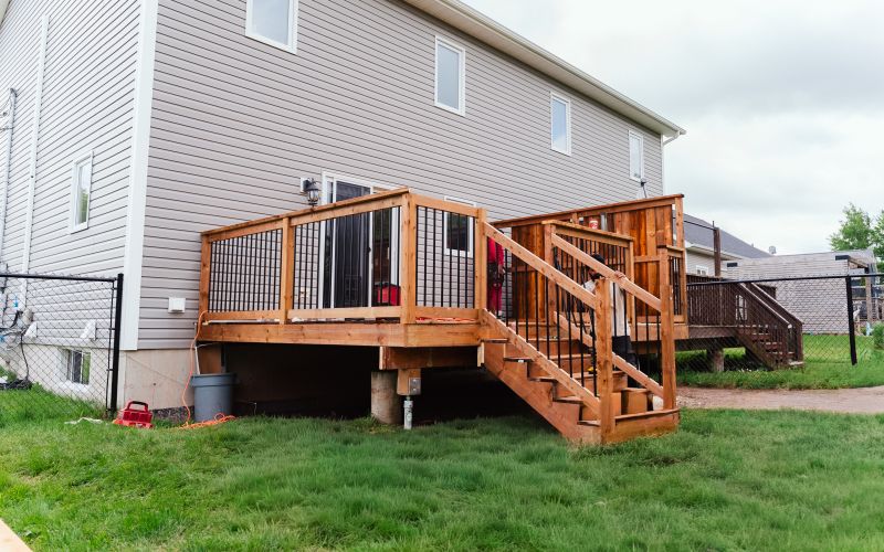 Finished deck with black aluminum railings built by J.A. Kelly on Lorette St in Dieppe NB