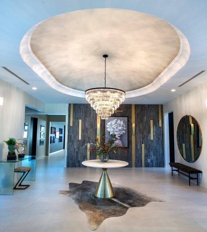 Modern entry room with chandelier