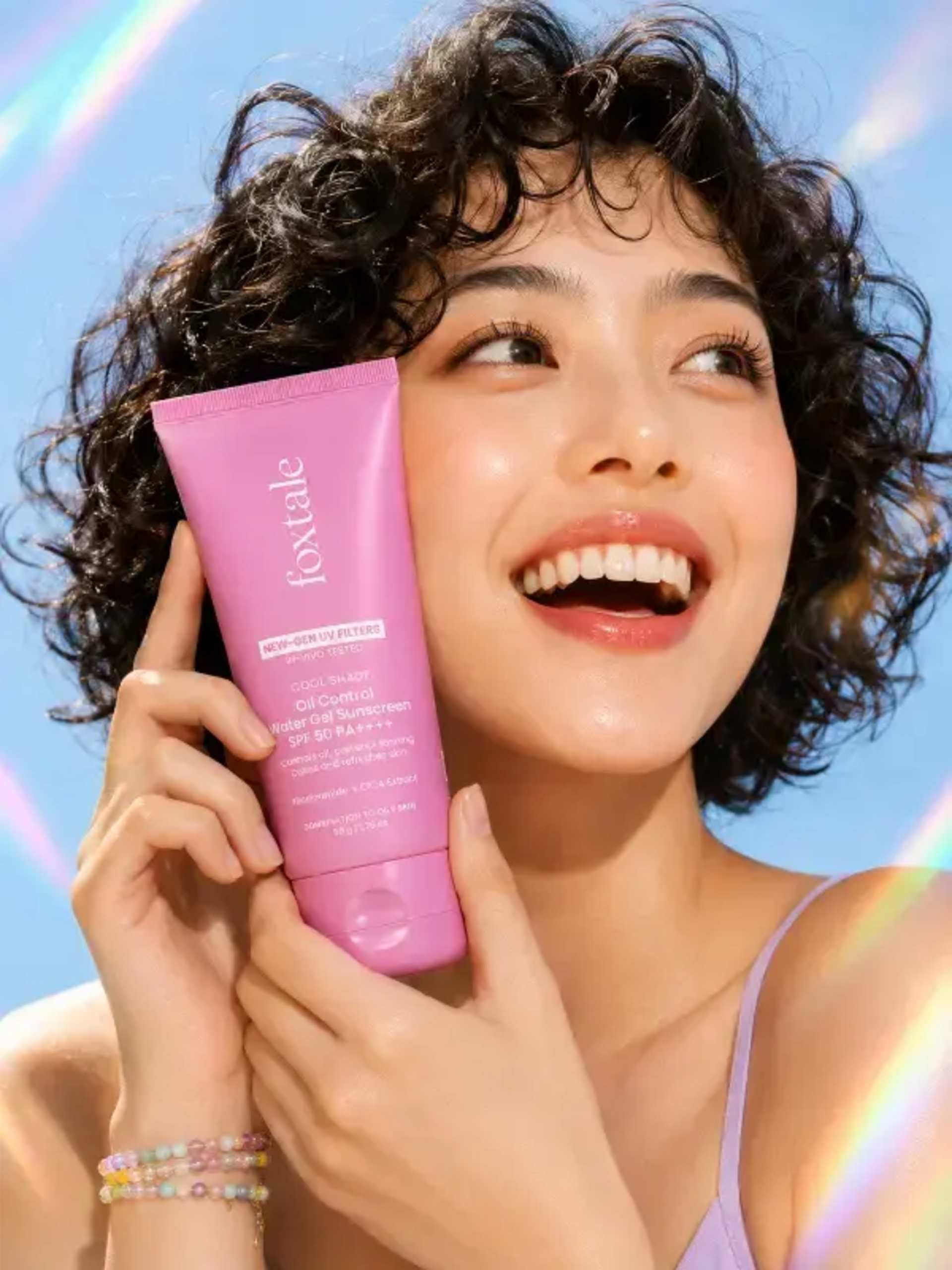 Joyful Skincare Ad: Custom Product & Rainbow Prisms prompt - skincare ad, beauty campaign, AI image prompt, product photography, clean beauty, vertical ad, rainbow prism, curly hair model, cosmetic marketing, prompt engineering