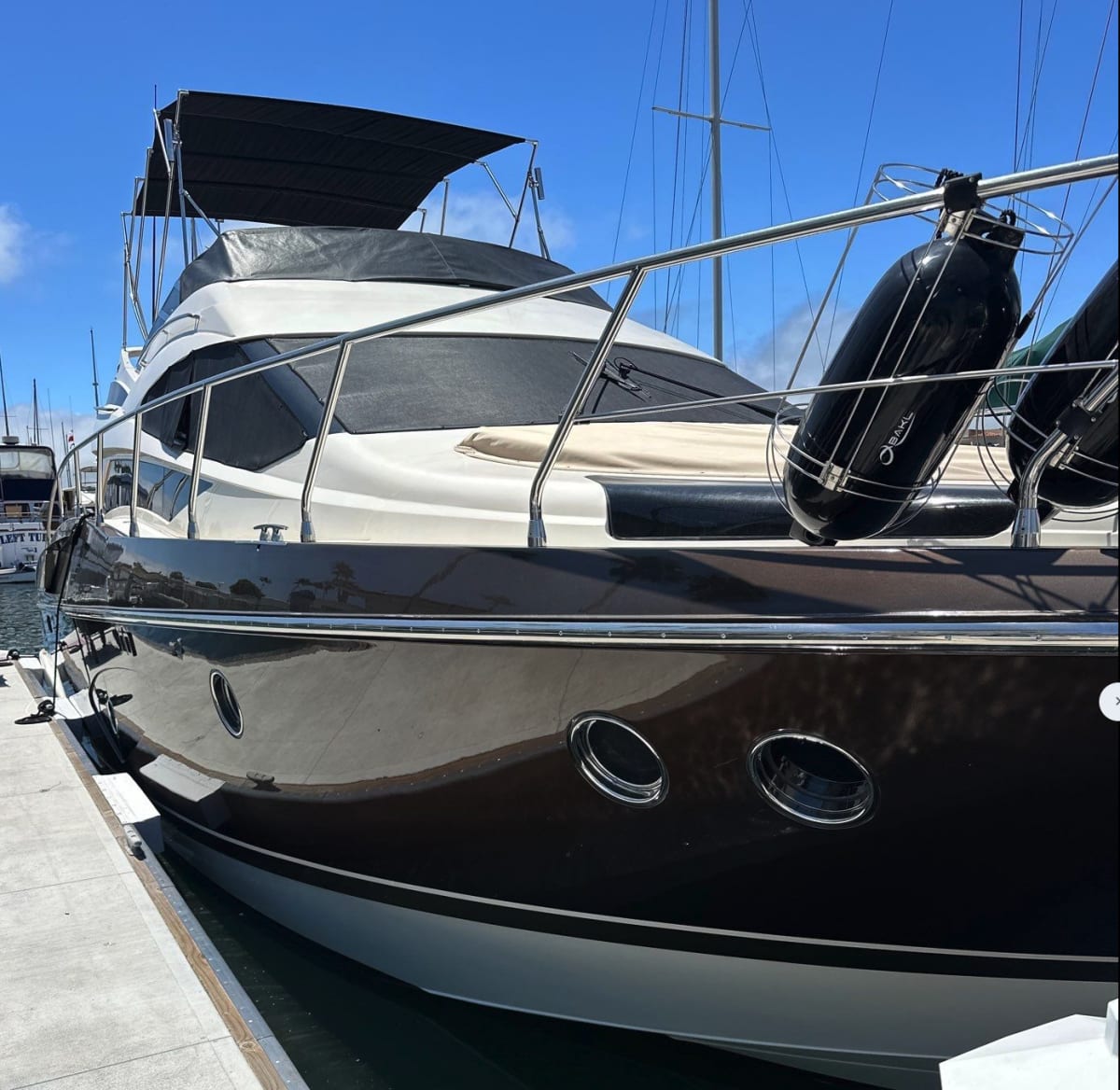 53-foot sport yacht alongside the dock in San Diego, part of the Fleet of Familiarity