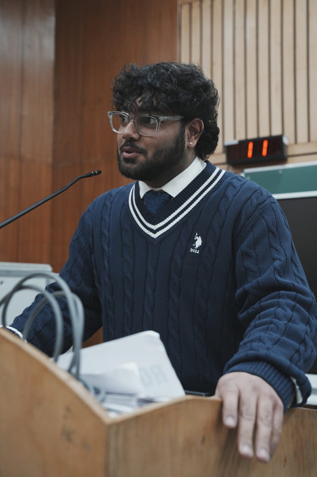 A Taivas student speaking at the lectern
