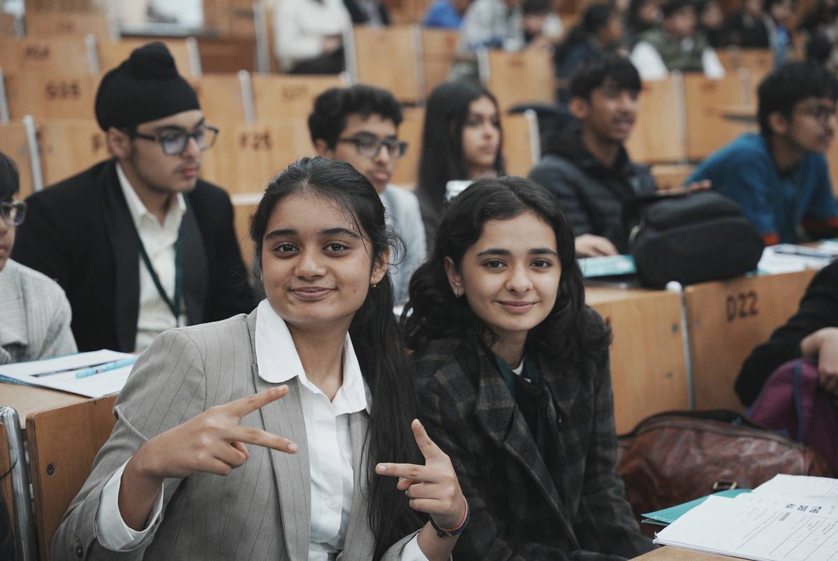 Students in lecture hall smiling