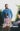 An adult and a child stand in a vineyard, with the child looking upset. The image has text overlaid that says 'Blood Wine Red'. blurred out low res