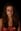 A woman with a distressed expression gazes directly at the viewer, her face partially obscured by shadows and what appears to be a wound. blurred out low res