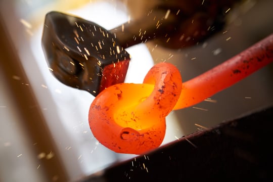 Hammer hitting a metal object