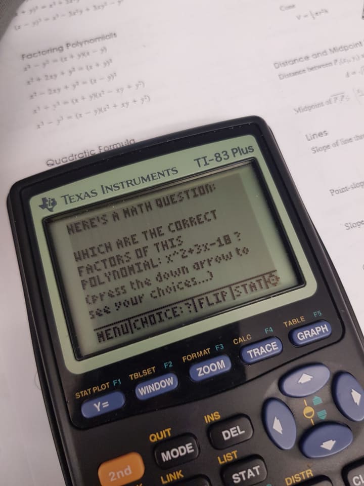 A close-up photograph of a TI-83 Plus calculator displaying a math problem. The image captures the calculator's screen and buttons alongside printed equations.
