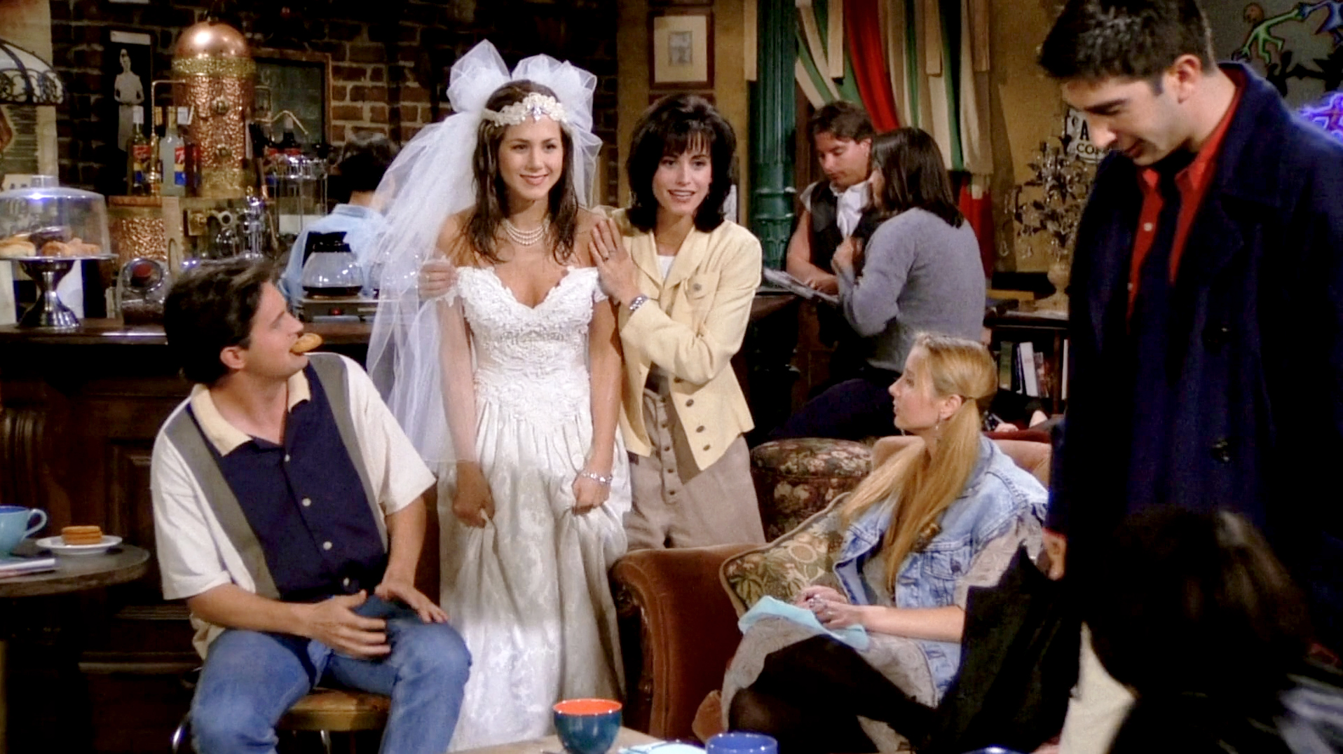 Close-up of Rachel's runaway bride look—lace wedding dress, tulle veil, and pearl choker