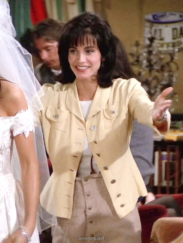 Monica in pale yellow jacket and white ribbed tee at Central Perk, Friends S1E1