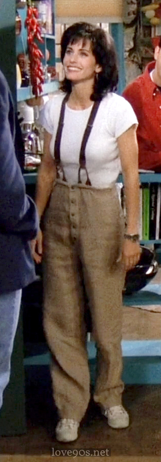 Monica wearing beige linen trousers with dark suspenders, Friends pilot