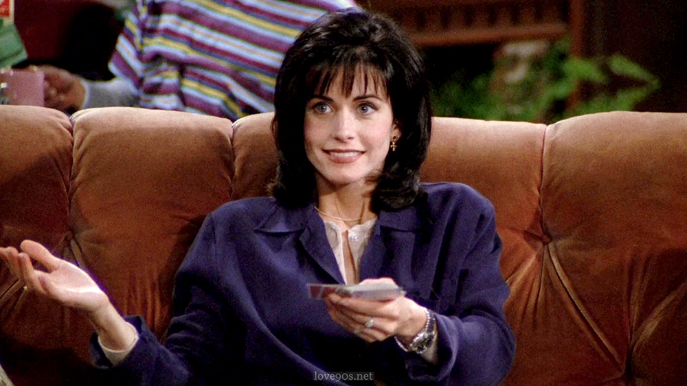 Monica Geller wearing navy blue blazer with denim jeans at Central Perk in Friends Season 1 Episode 1