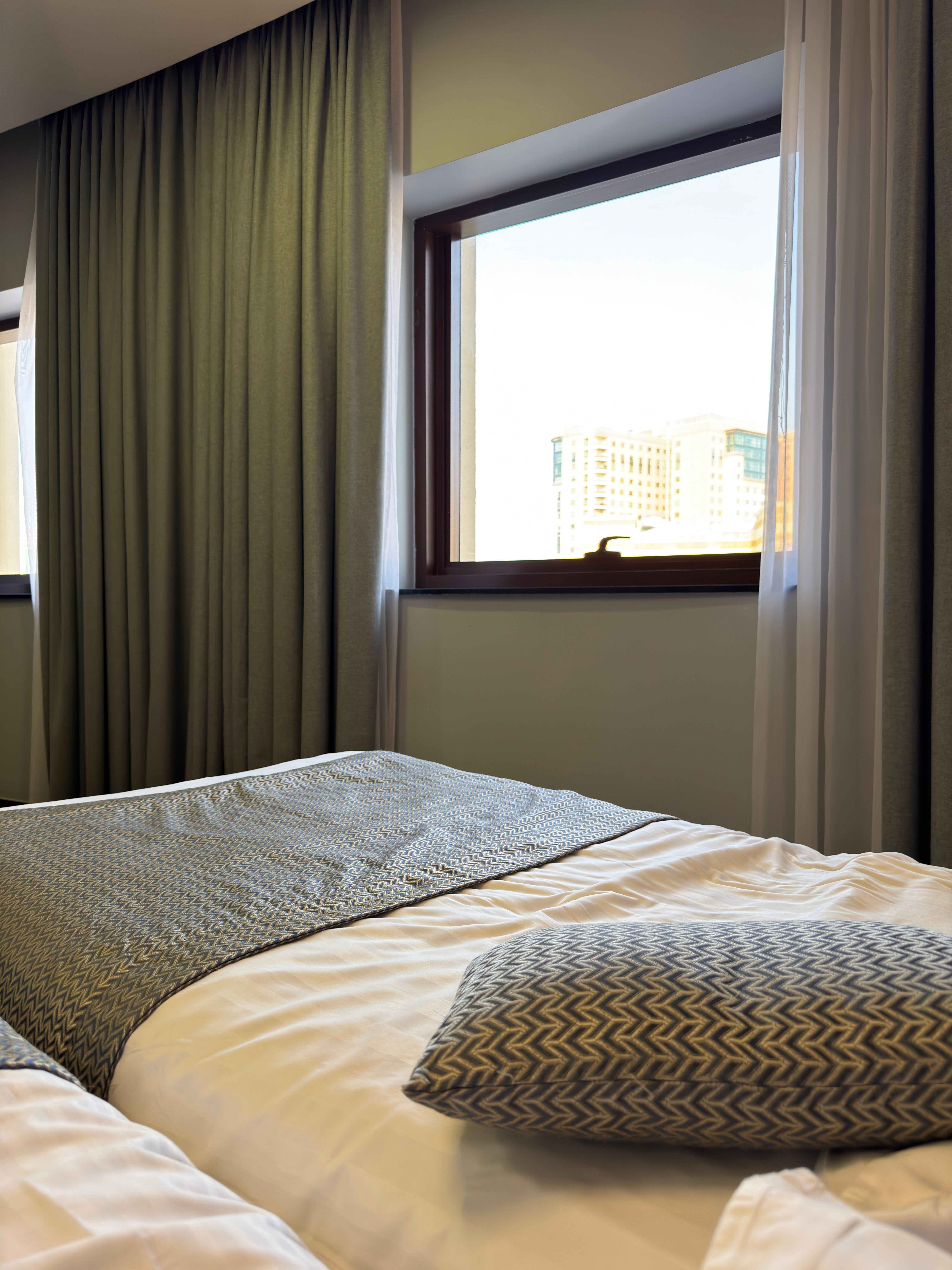 A bright, design-forward hostel common room or a simple stylish budget hotel room in Barcelona