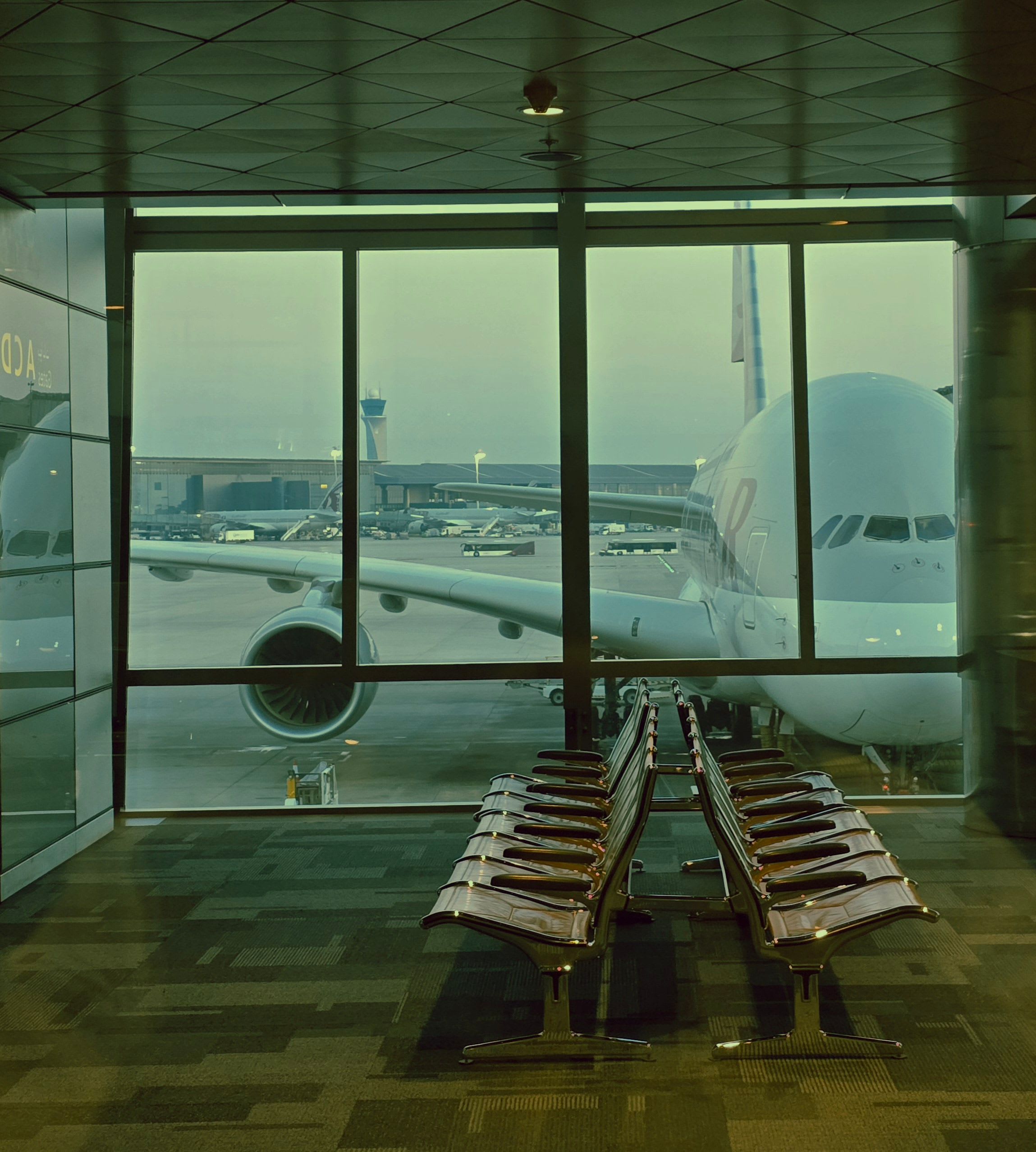 A widebody jet at a gate or Barcelona El Prat airport exterior
