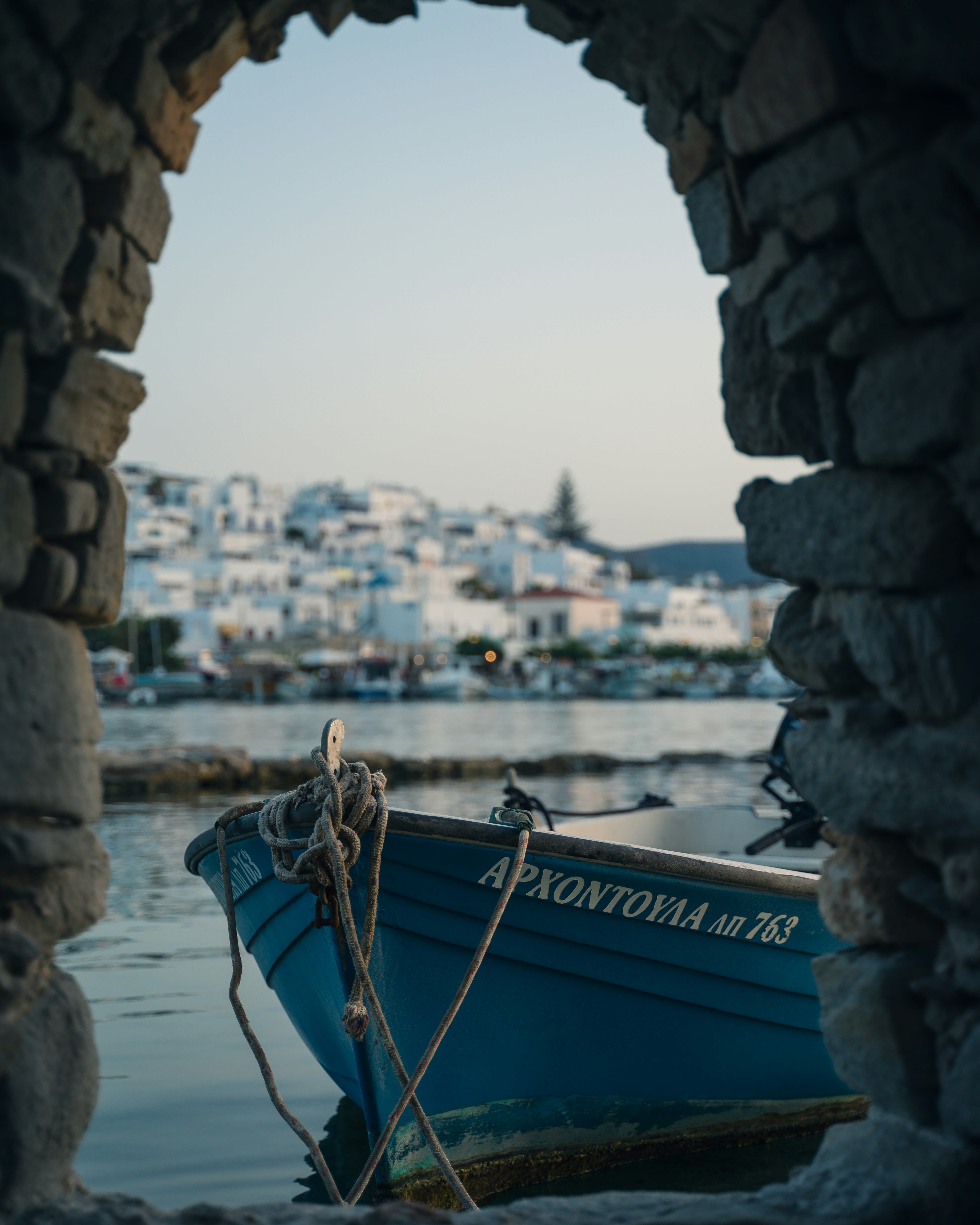 Naoussa harbor on Paros at dusk, fishing boats and waterfront tavernas