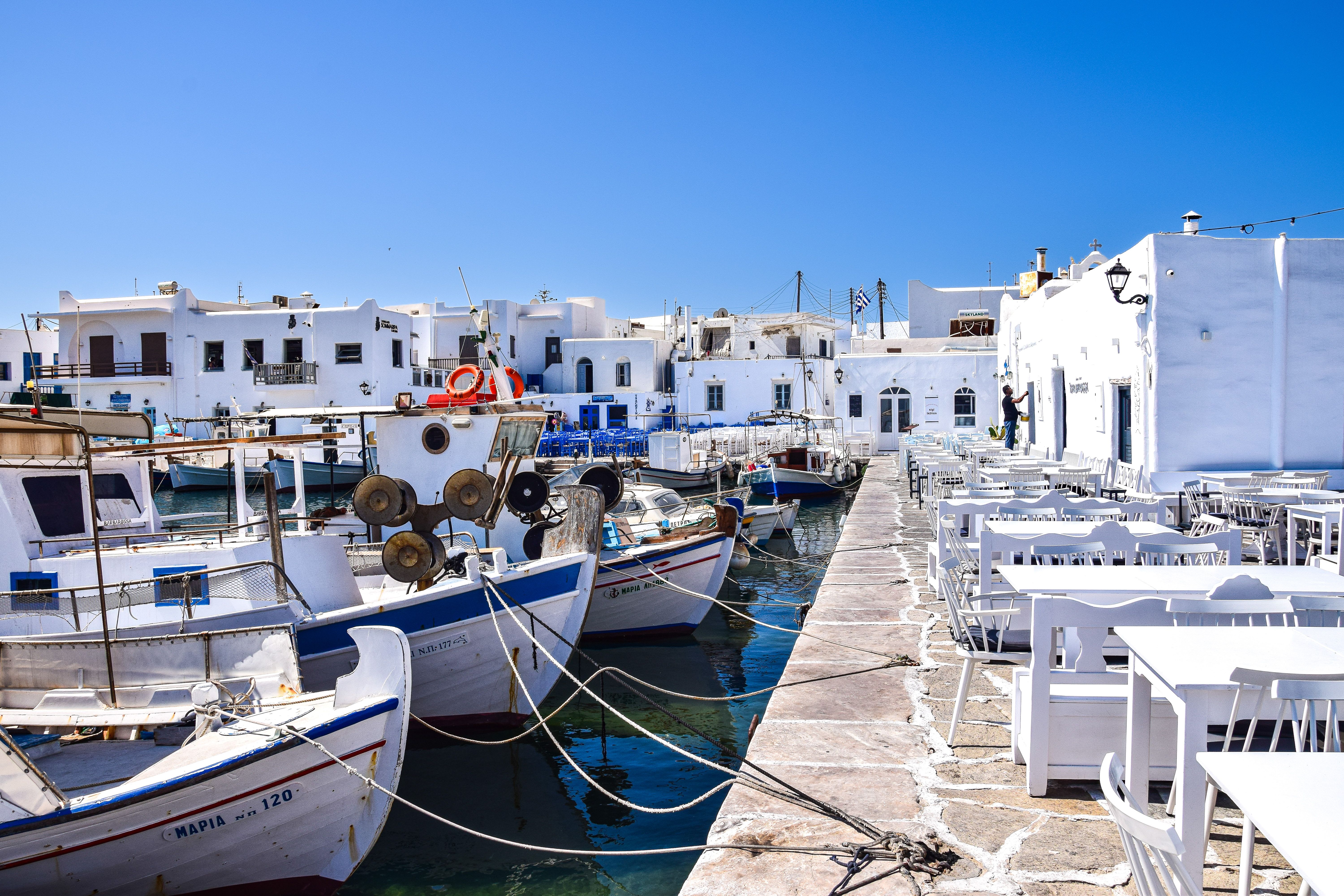 Naoussa's picturesque fishing harbor with boats and waterfront tavernas