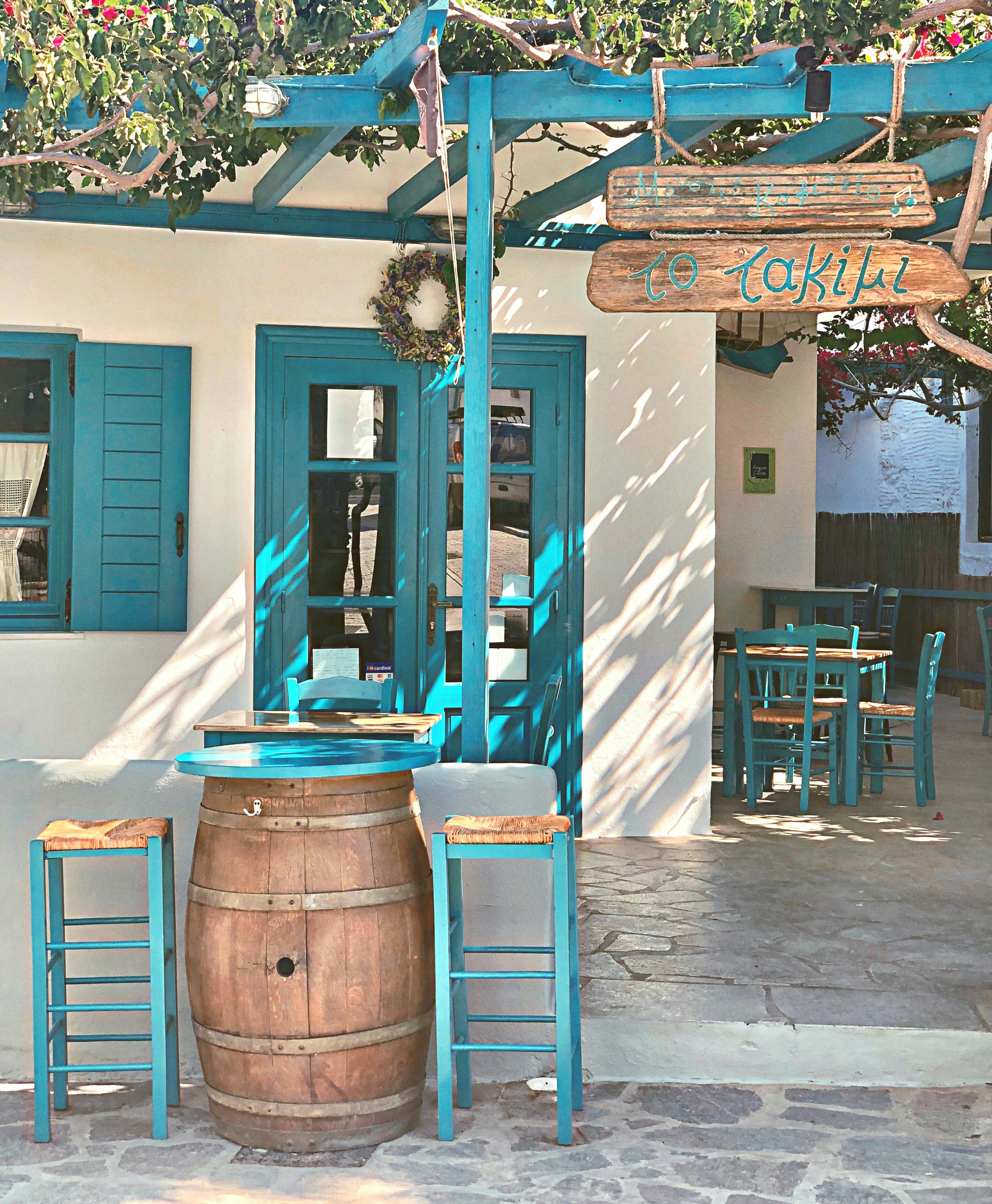 A relaxed Greek scene suggesting good value — a taverna or village street