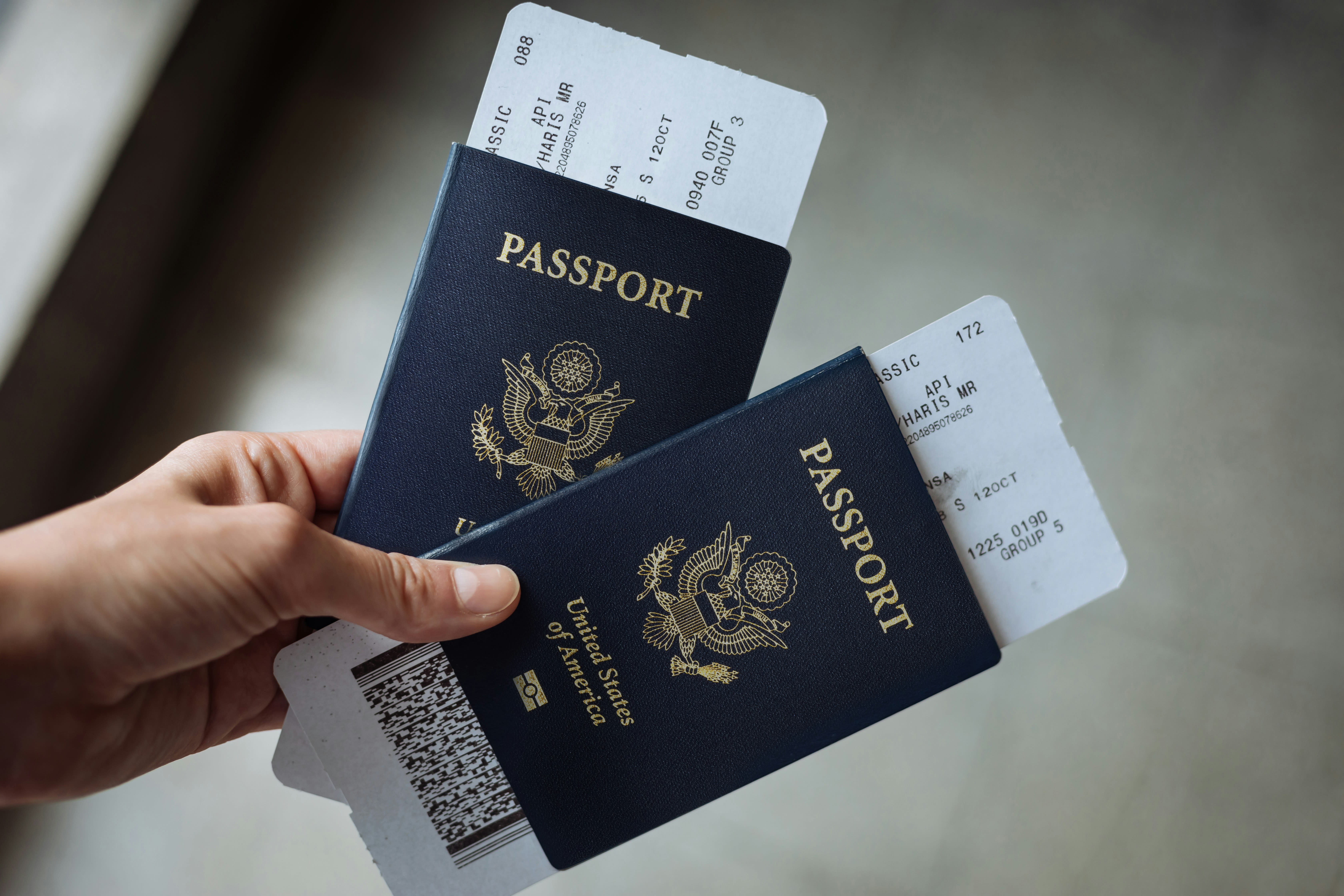 A US passport with boarding pass, evoking travel to Greece