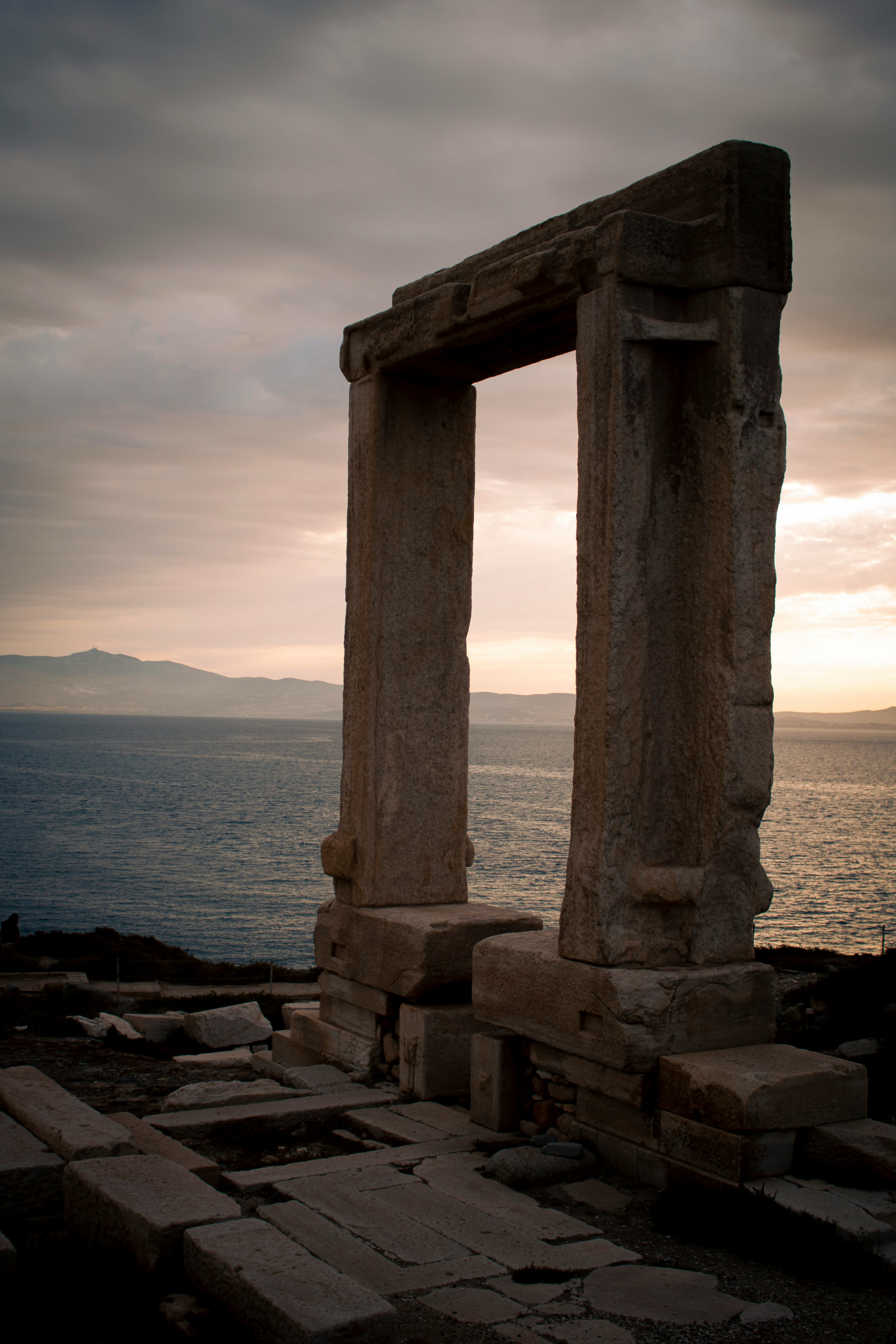 The marble Portara gateway on Naxos silhouetted at sunset