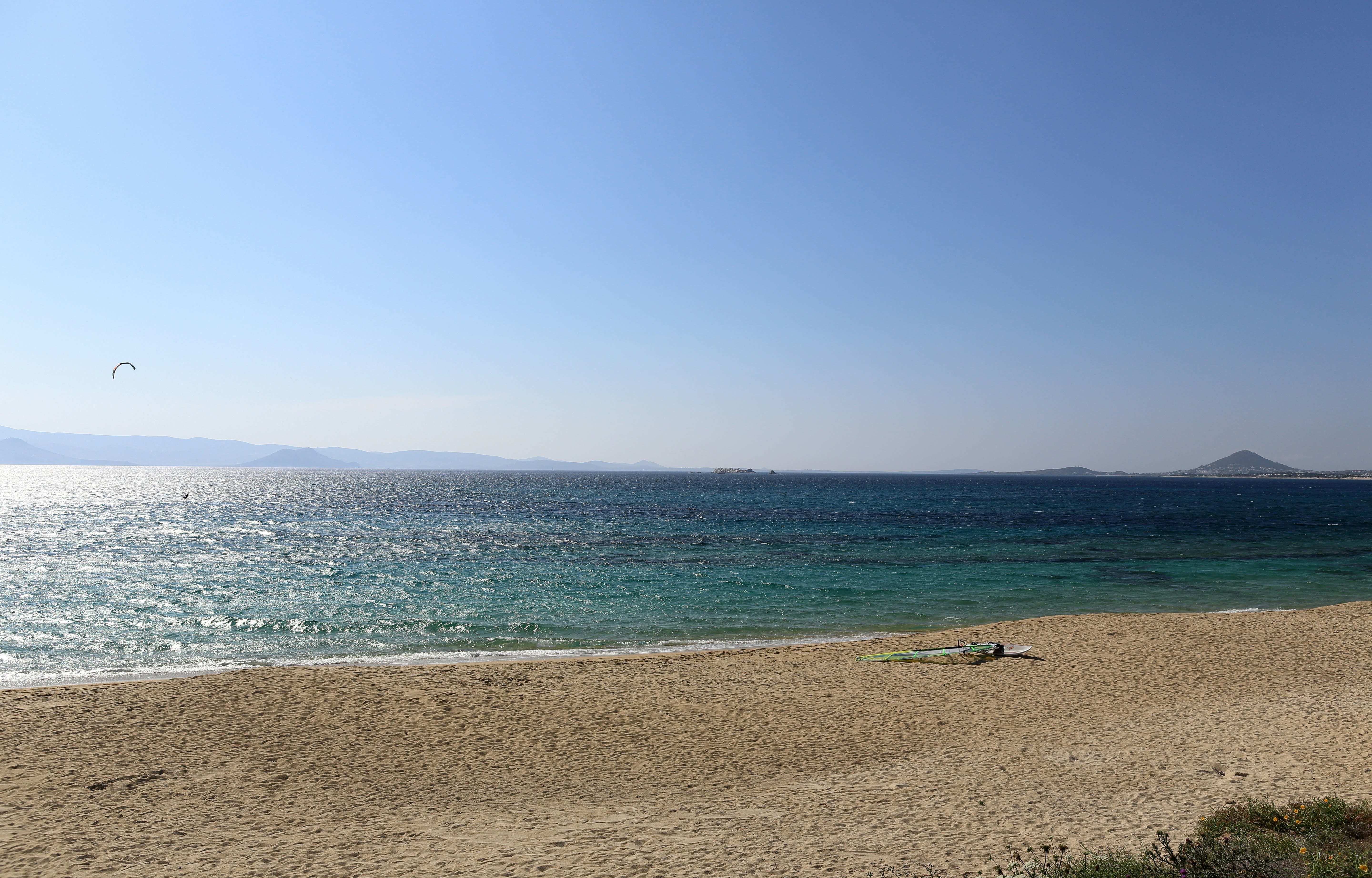 A long sandy Naxos beach like Agios Prokopios with shallow turquoise water