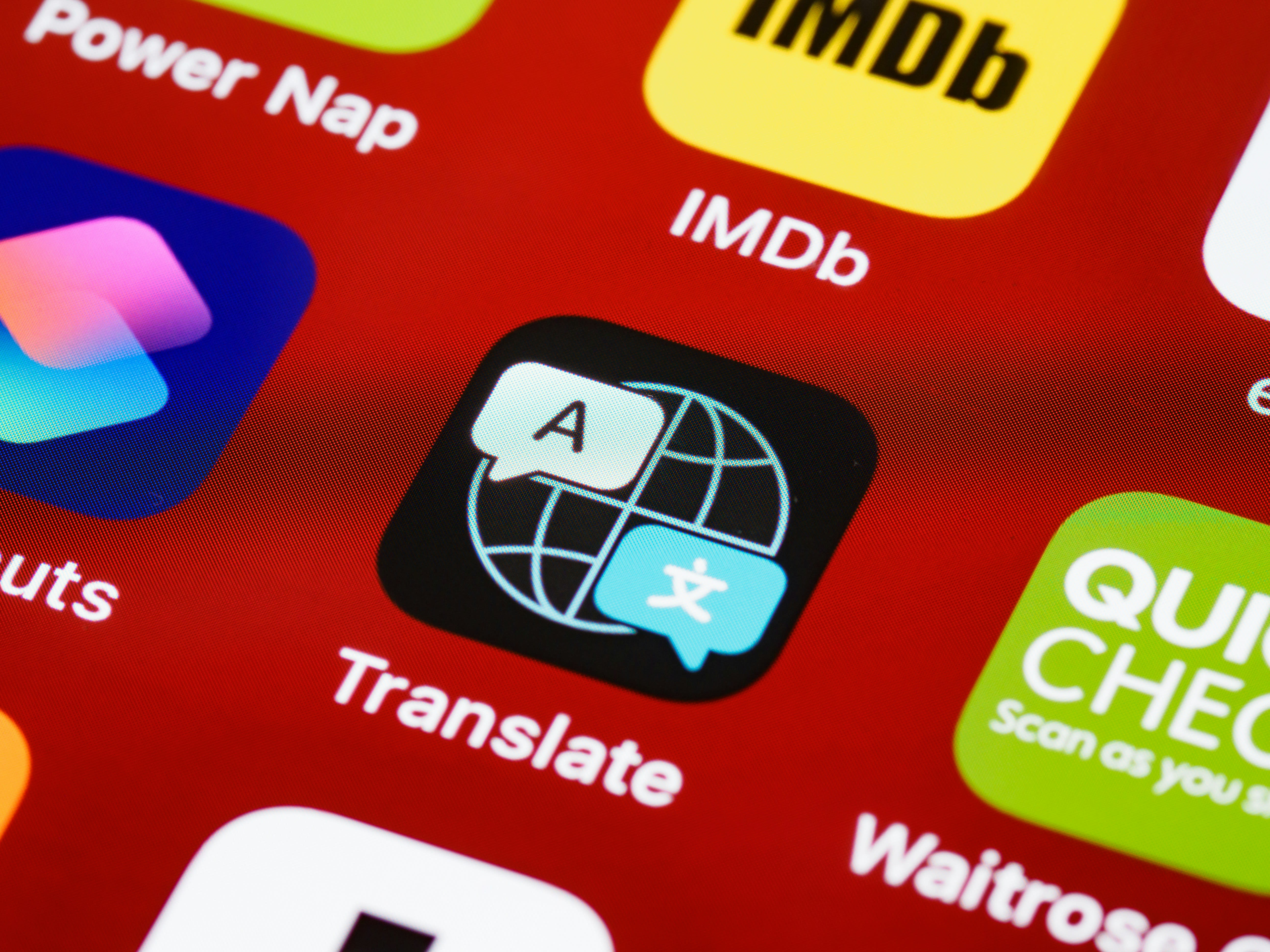 A phone showing a maps or translation app with Thai text