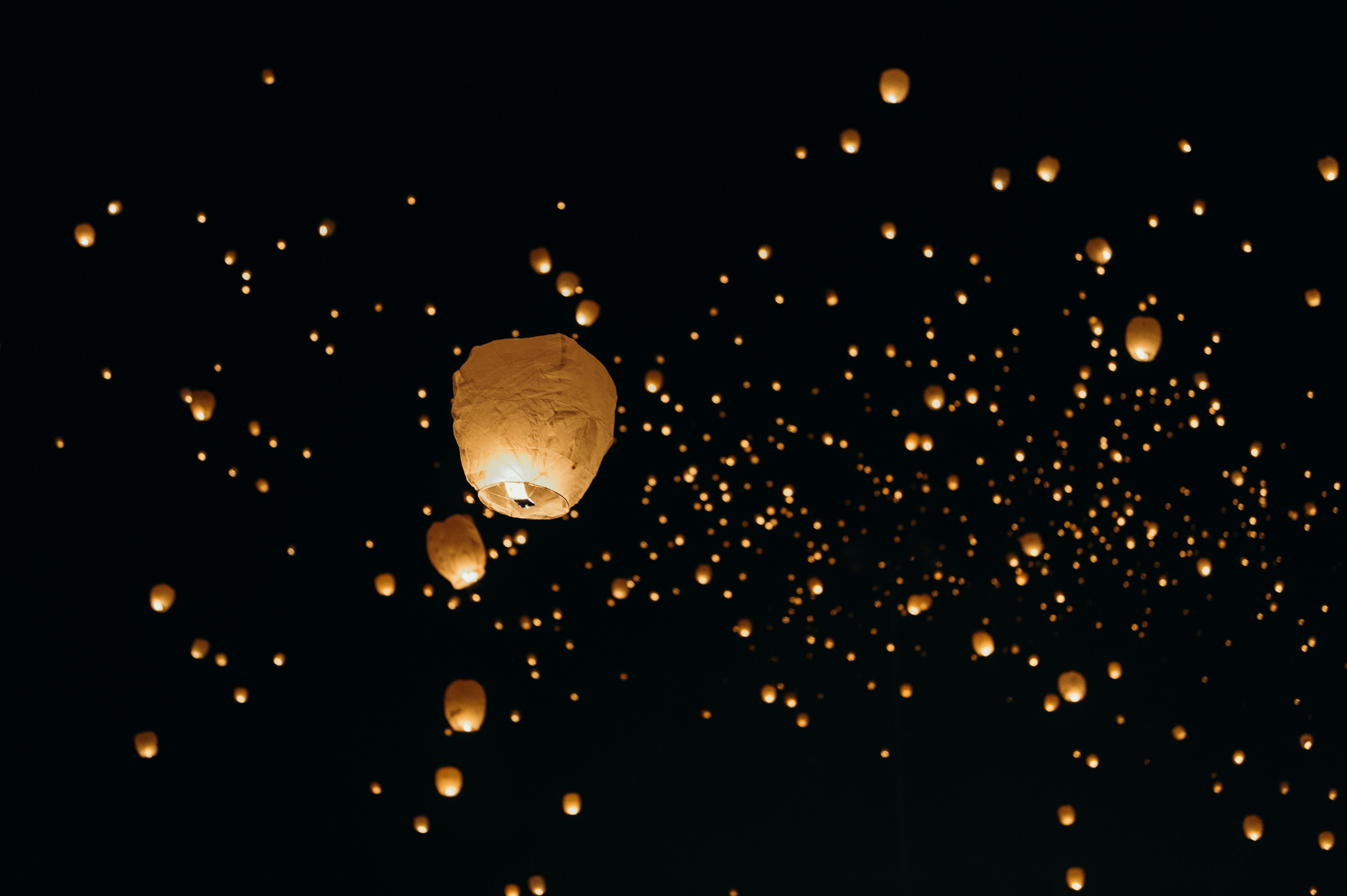 A vibrant Thai festival scene — lanterns, water, or a colorful procession
