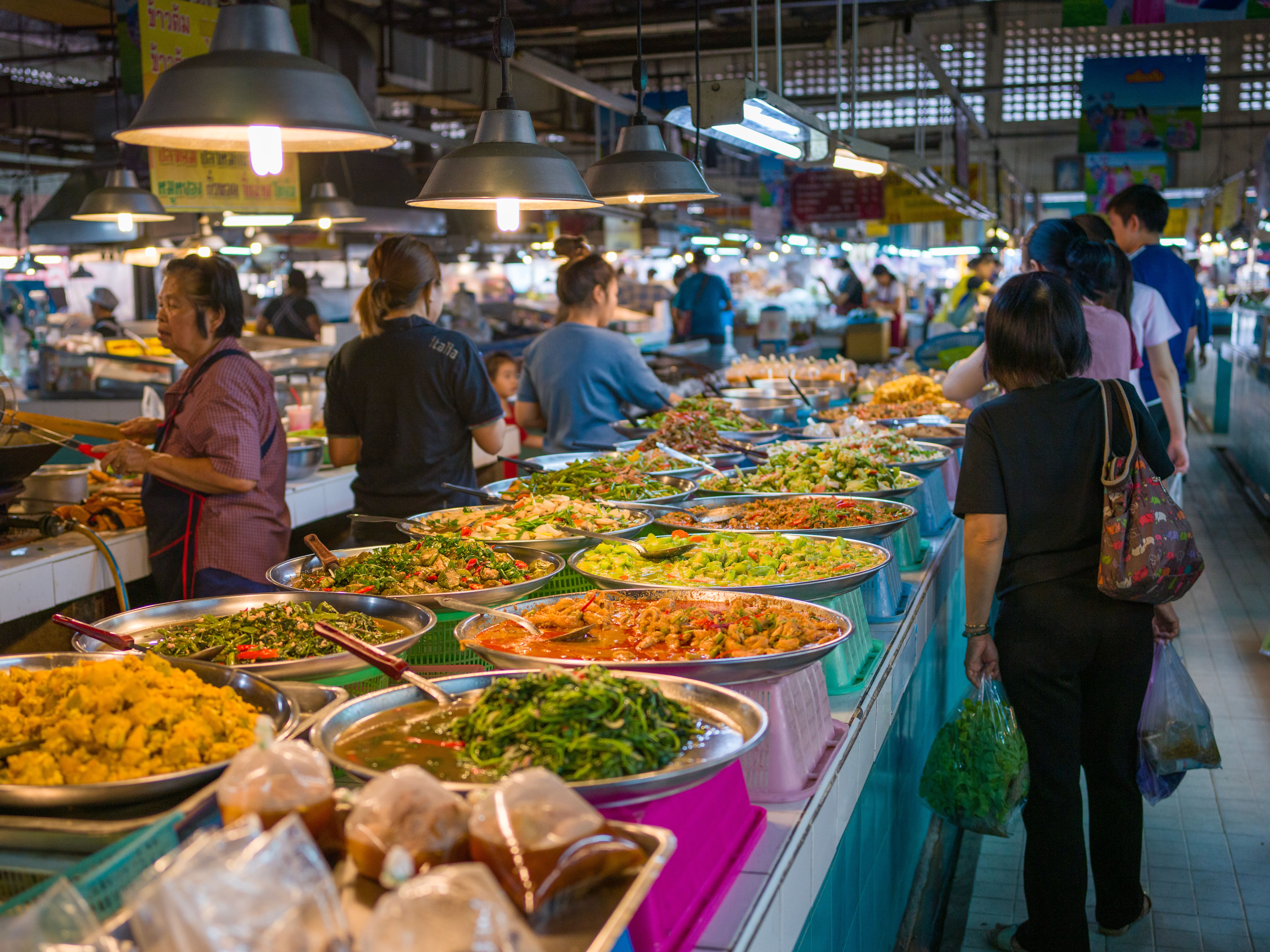 A colorful spread of Thai dishes on a table