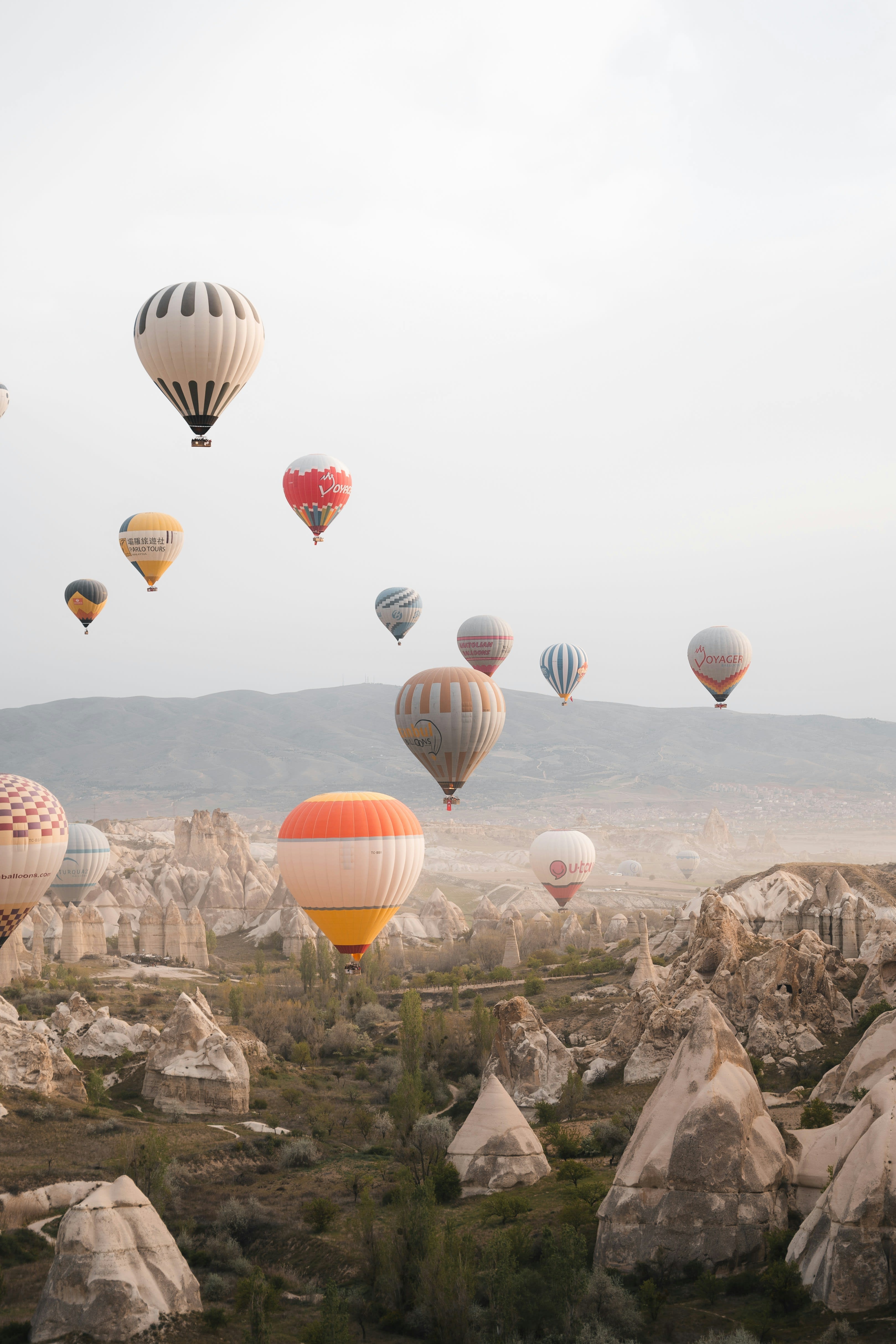 Hot air balloons over Cappadocia on a clear shoulder-season morning