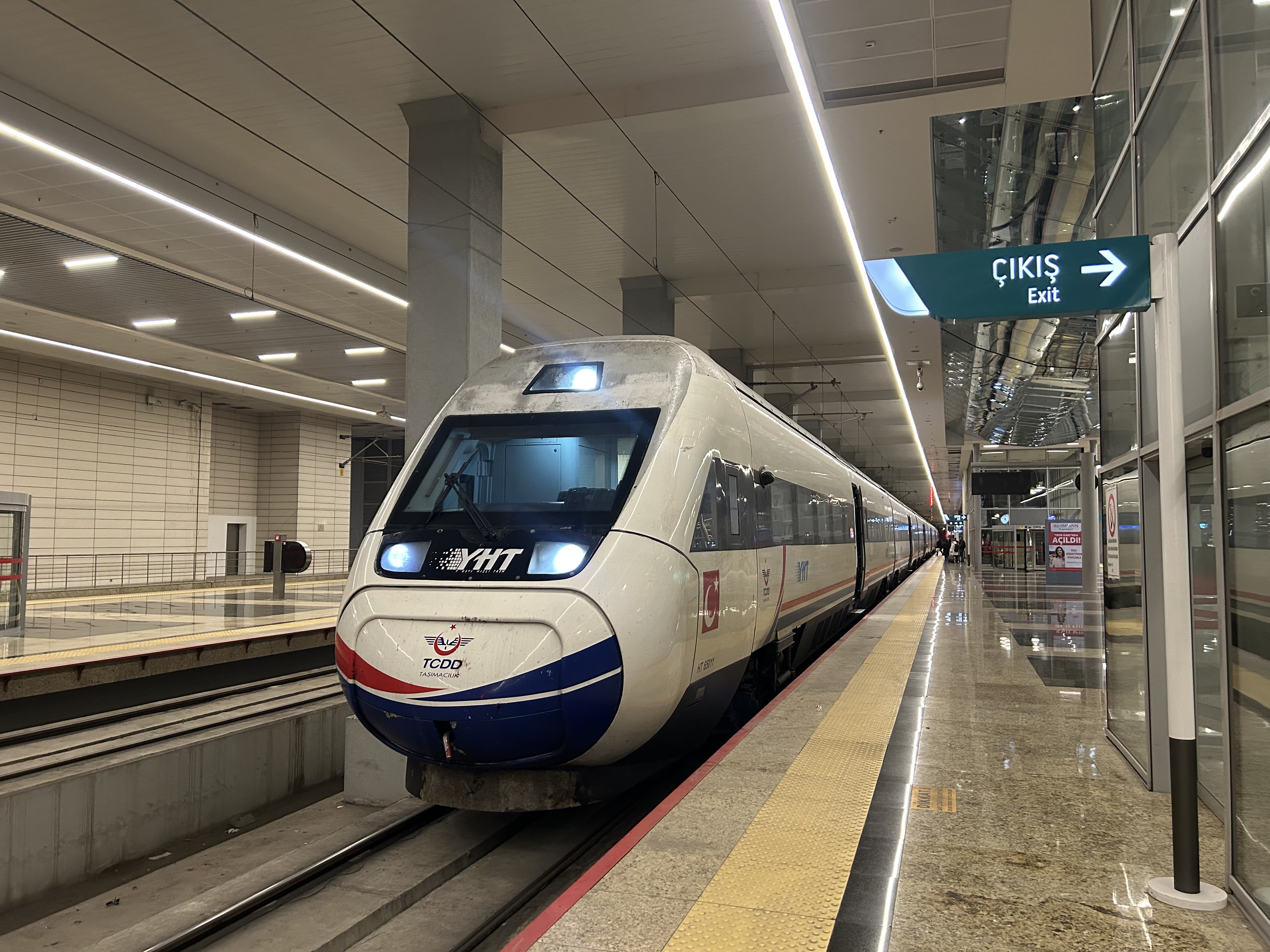 A Turkish intercity scene — a modern train, bus, or domestic plane, no recognizable faces