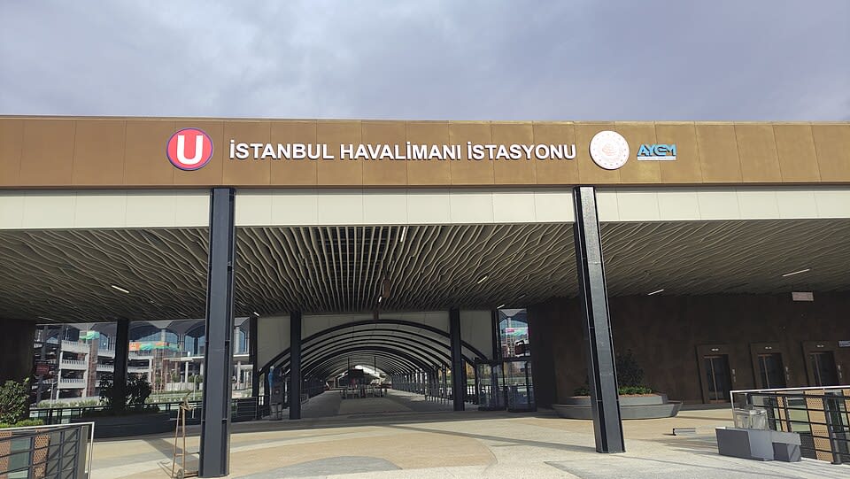 Modern interior of Istanbul Airport arrivals with transport signage