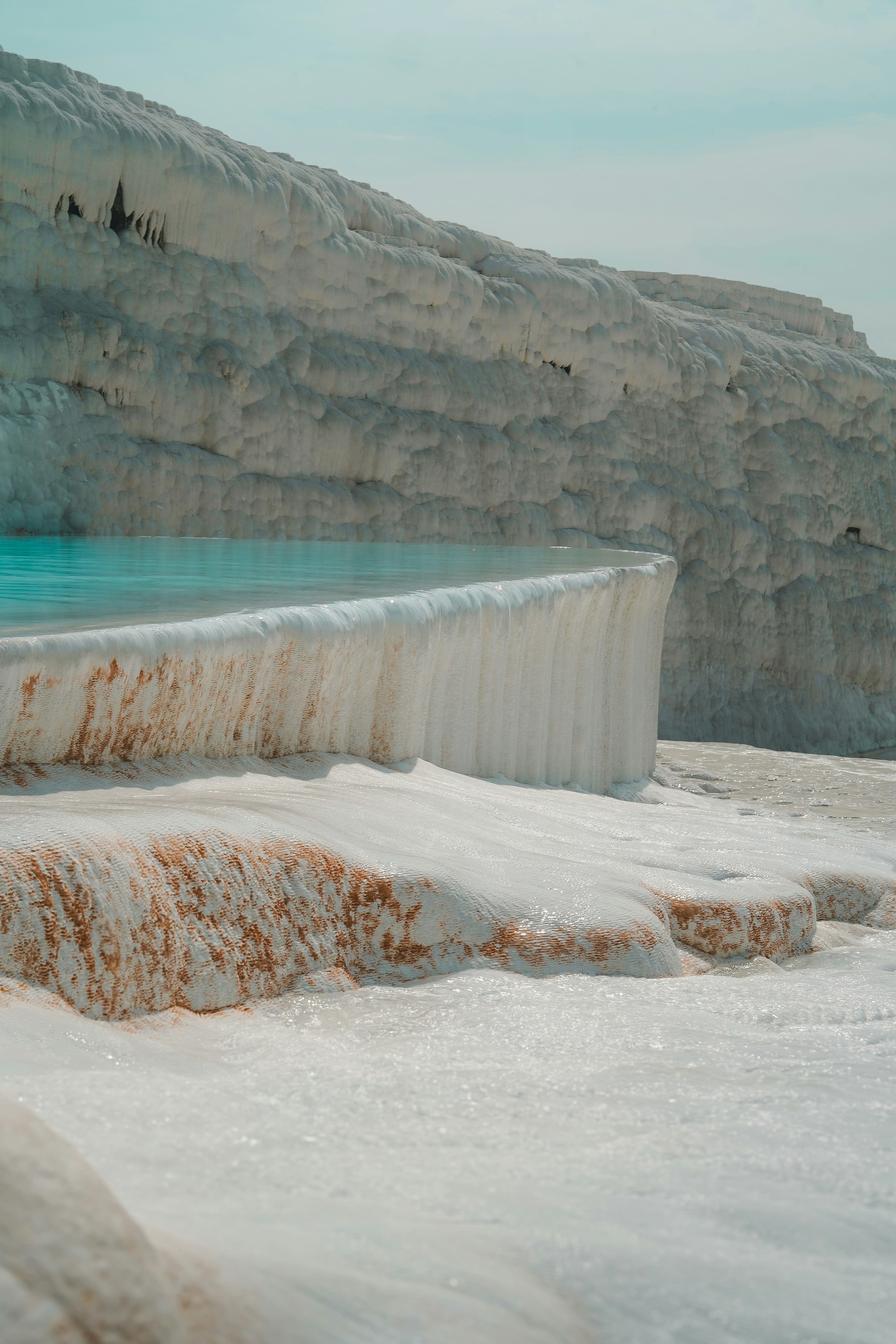 The white travertine pools of Pamukkale cascading down the hillside