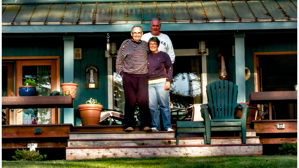 Will, Cathy, and John in front of the home on Whidbey Island
