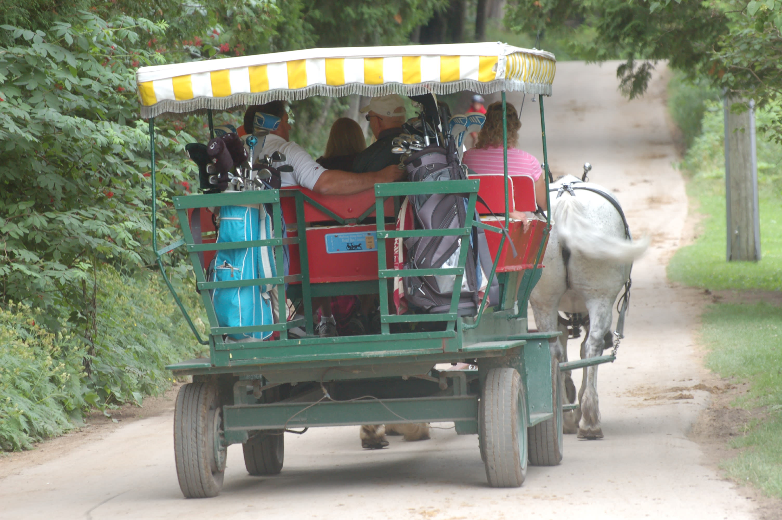 Loading clubs into the carriage between hole 9 and hole 10