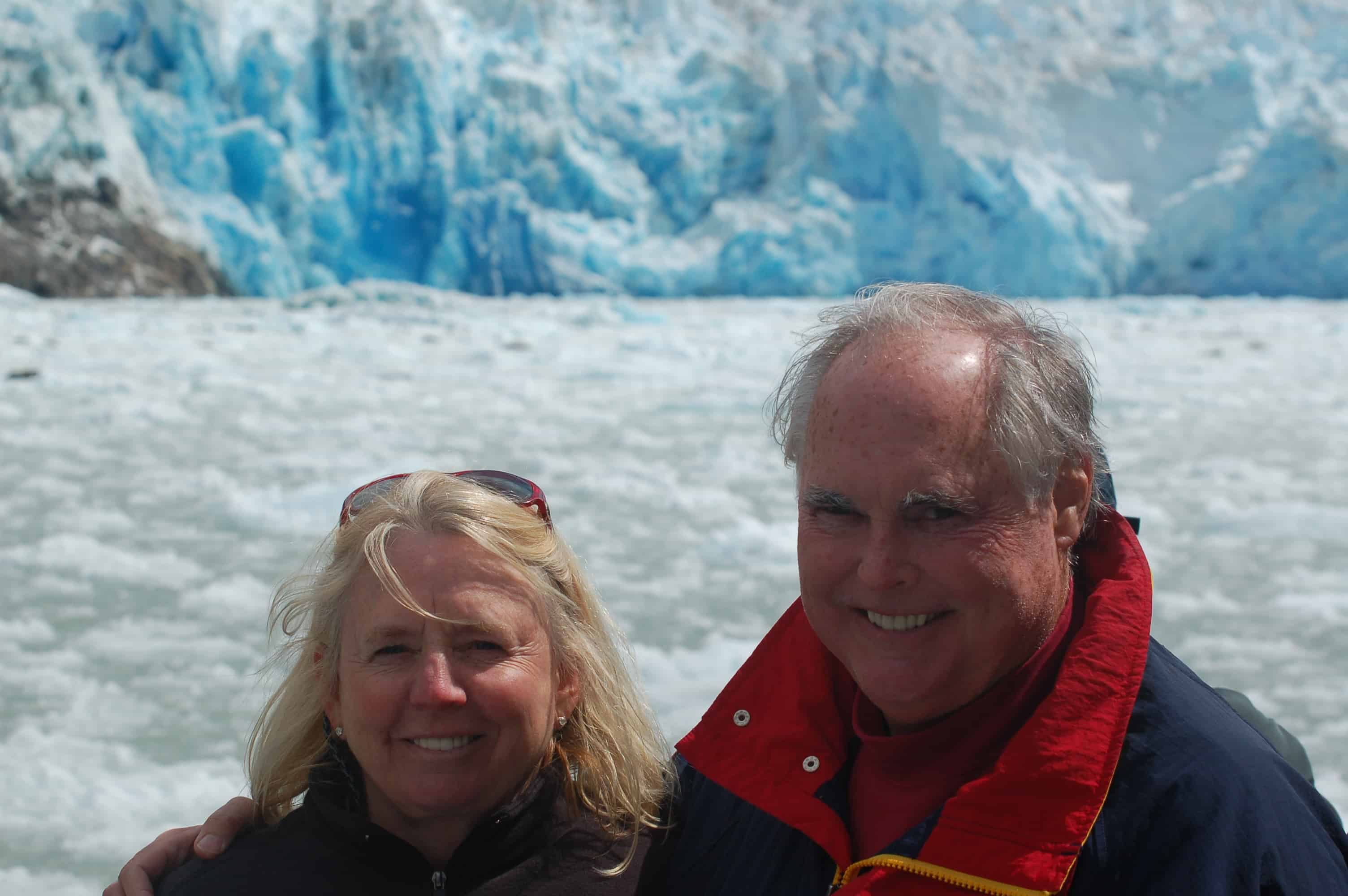 John and Janice with Sawyer Glacier behind them