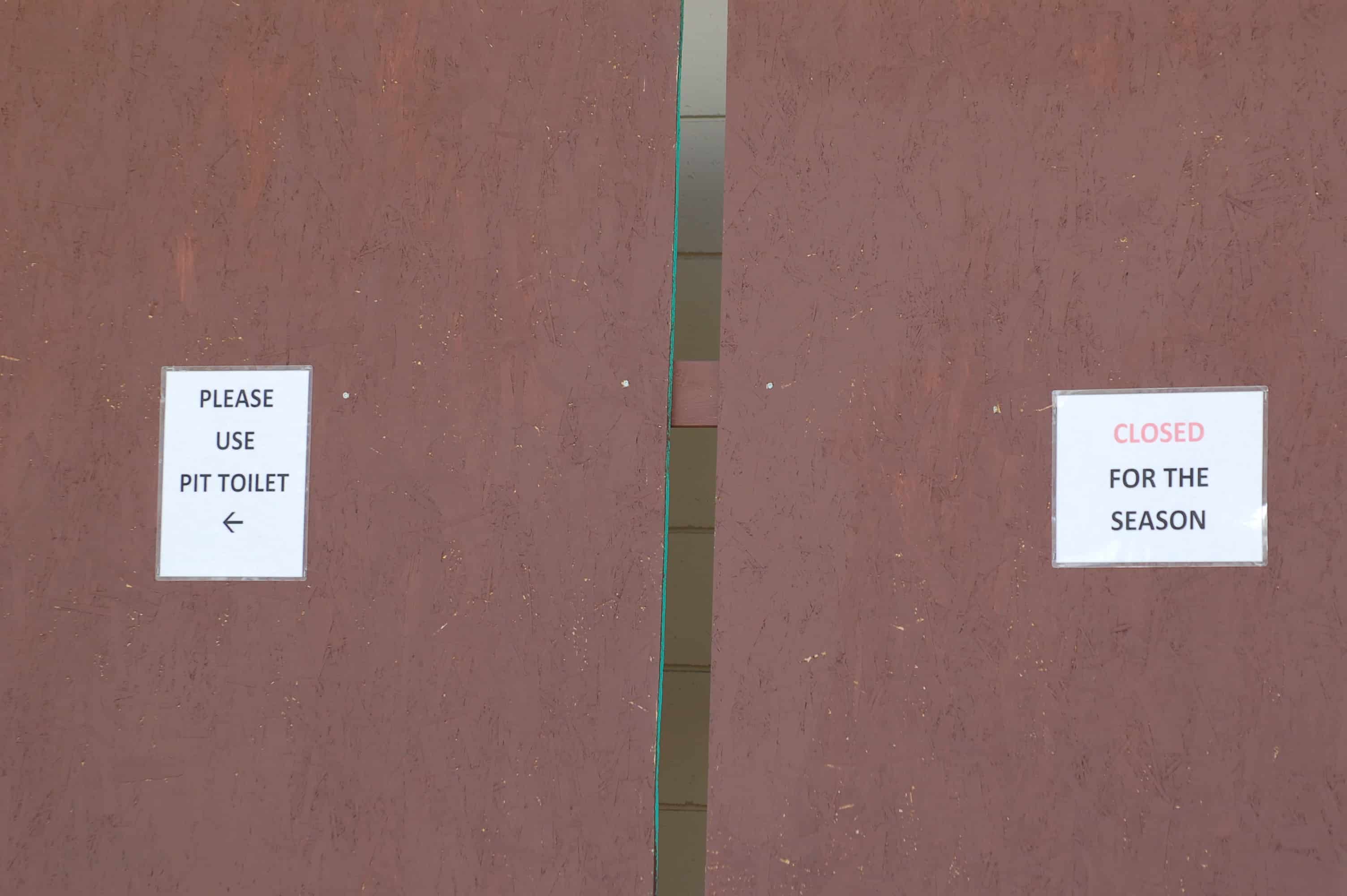 Road sign using pit instead of toilet, British Columbia