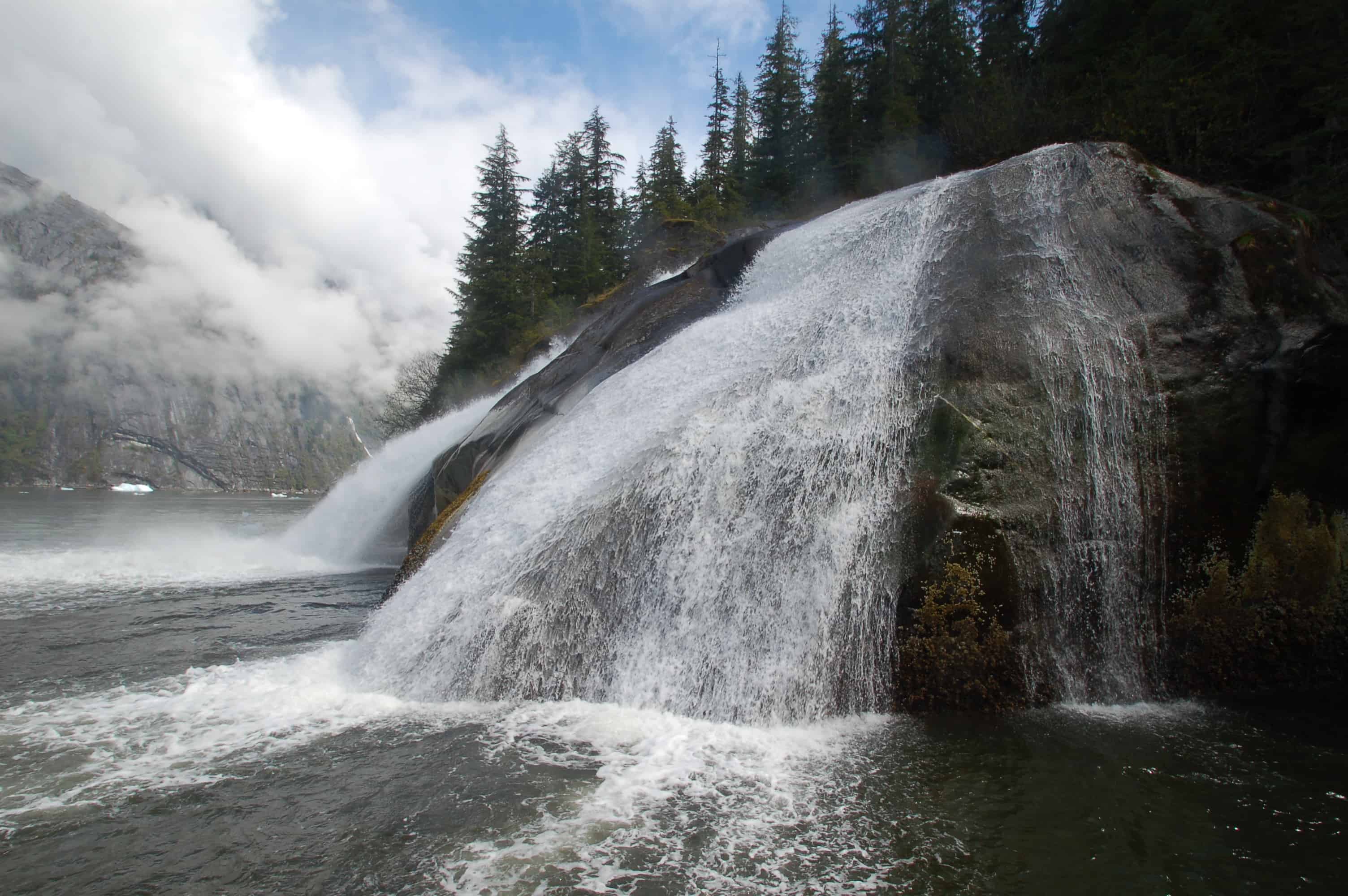 A waterfall along the fjord wall