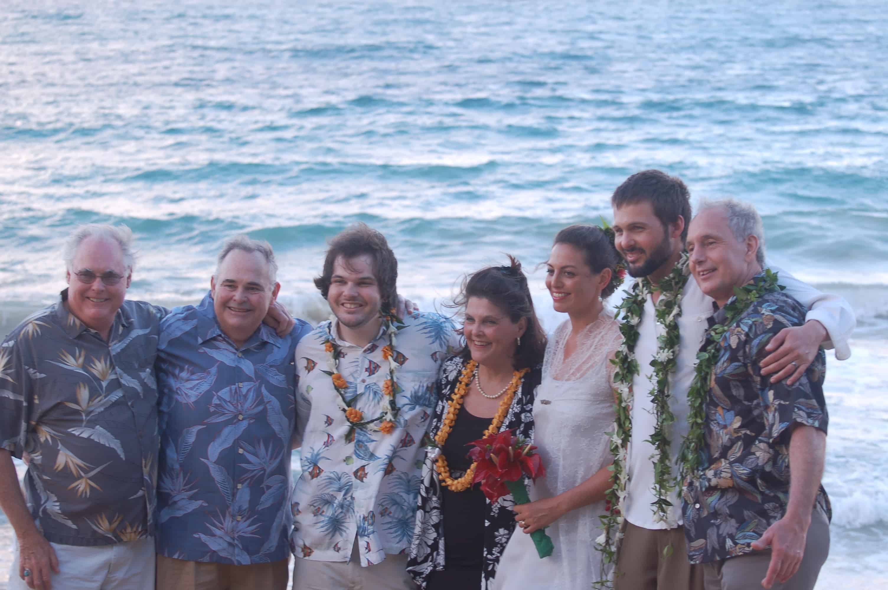 The bride and groom with the Wilson family and uncles
