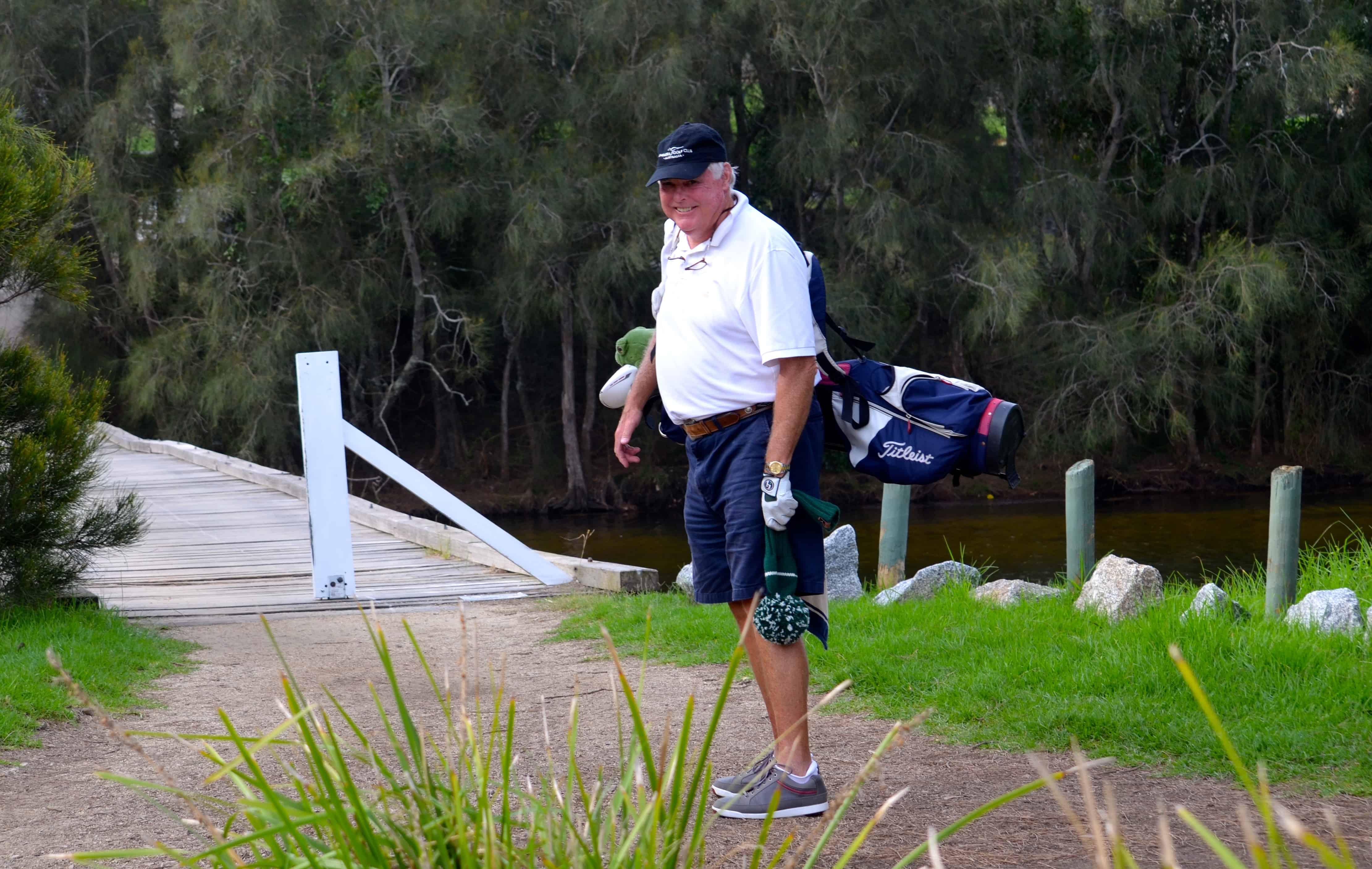 John on the bridge between the holes