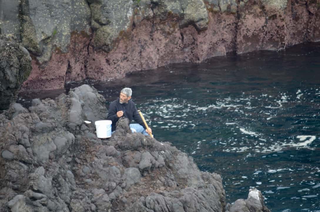 Men fishing off the cliffs of Sao Miguel