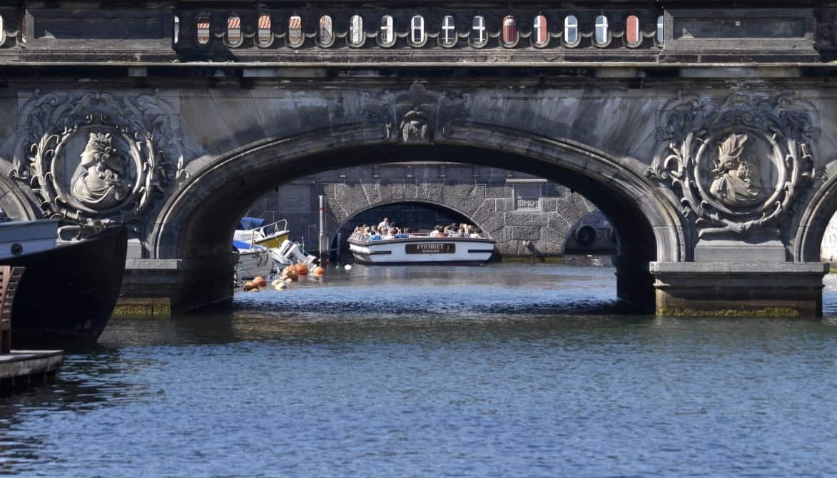 A Copenhagen canal bridge with carved faces
